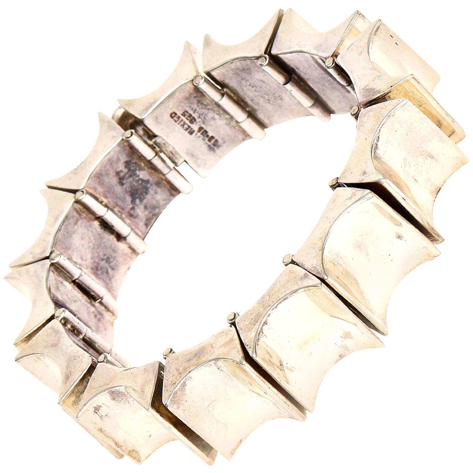 This stunning and substantial sterling silver hallmarked cuff bracelet is marked Mexico with initials and numbers 925. It has 13 links that reticulate. The vintage bracelet has a sculptural presence and form. This will fit any wrist as these links