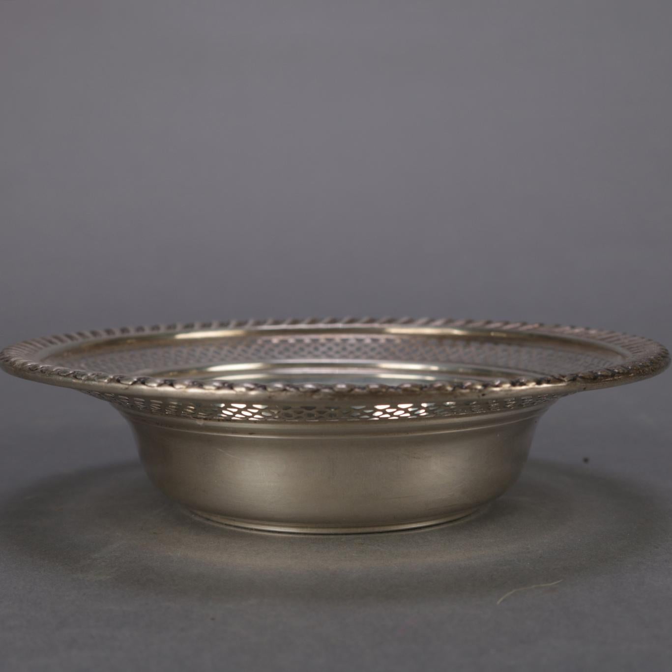 Sterling silver bowl features flared form with reticulated rim having rope twist border, marked Sterling on base, 1.35 toz, 20th century


Measures: 1.25