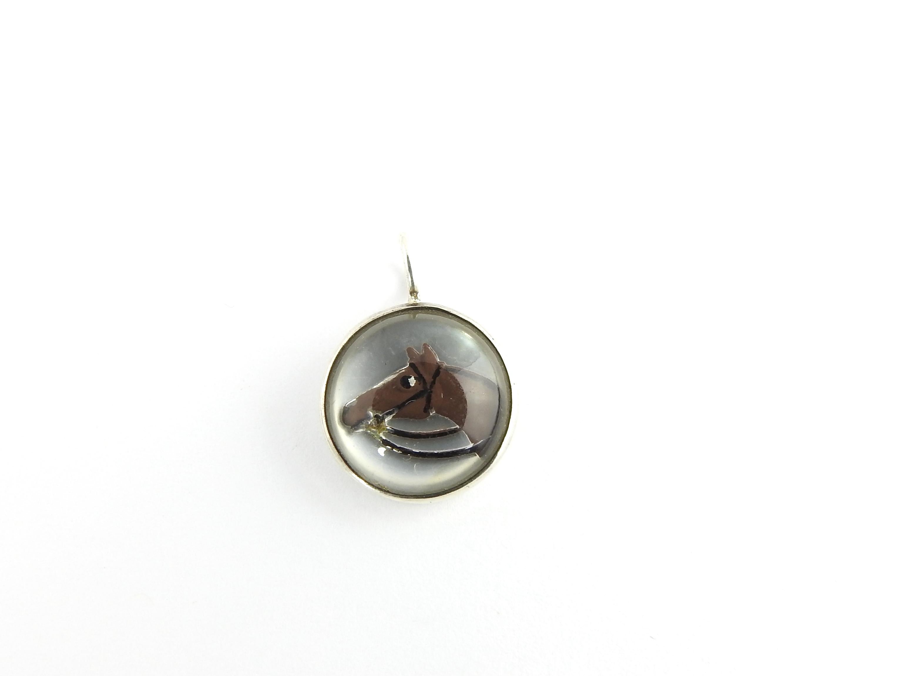 Vintage Sterling Silver Reverse Intaglio Horse Pendant

This lovely pendant features a beautifully detailed horse portrait in reverse Intaglio glass set in sterling silver.

Size: 14 mm

Weight: 1.2 dwt. / 2.0 gr.

Stamped: Sterling

Very good