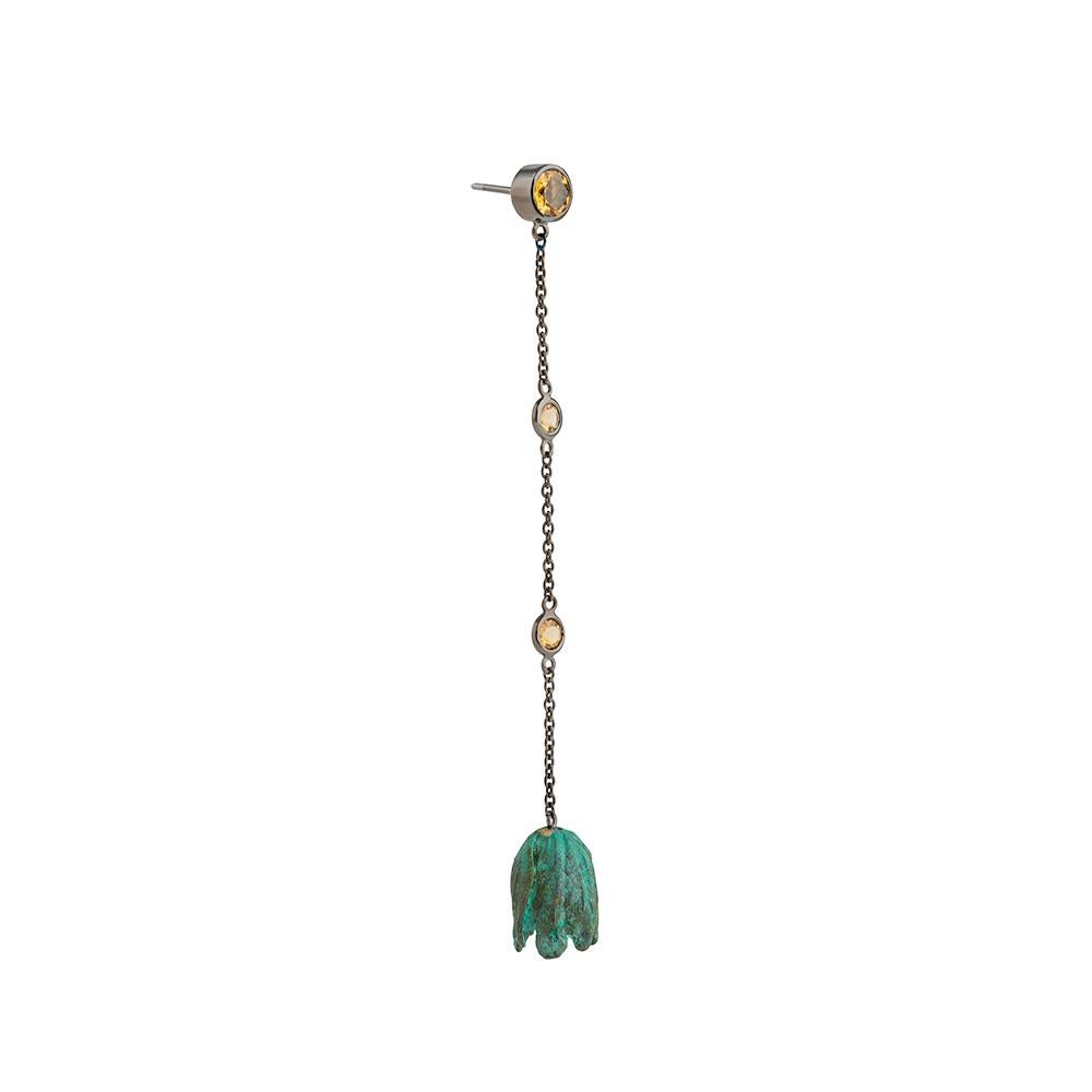 Sterling silver, rhodium, verdigris brass and citrine earrings
Hallmarked
Edition of 5

Hailing from the designer’s Once Upon a Time in My Secret Garden collection, these delicate citrine earrings recall dew drops suspended at dawn. Tessa notes, “As
