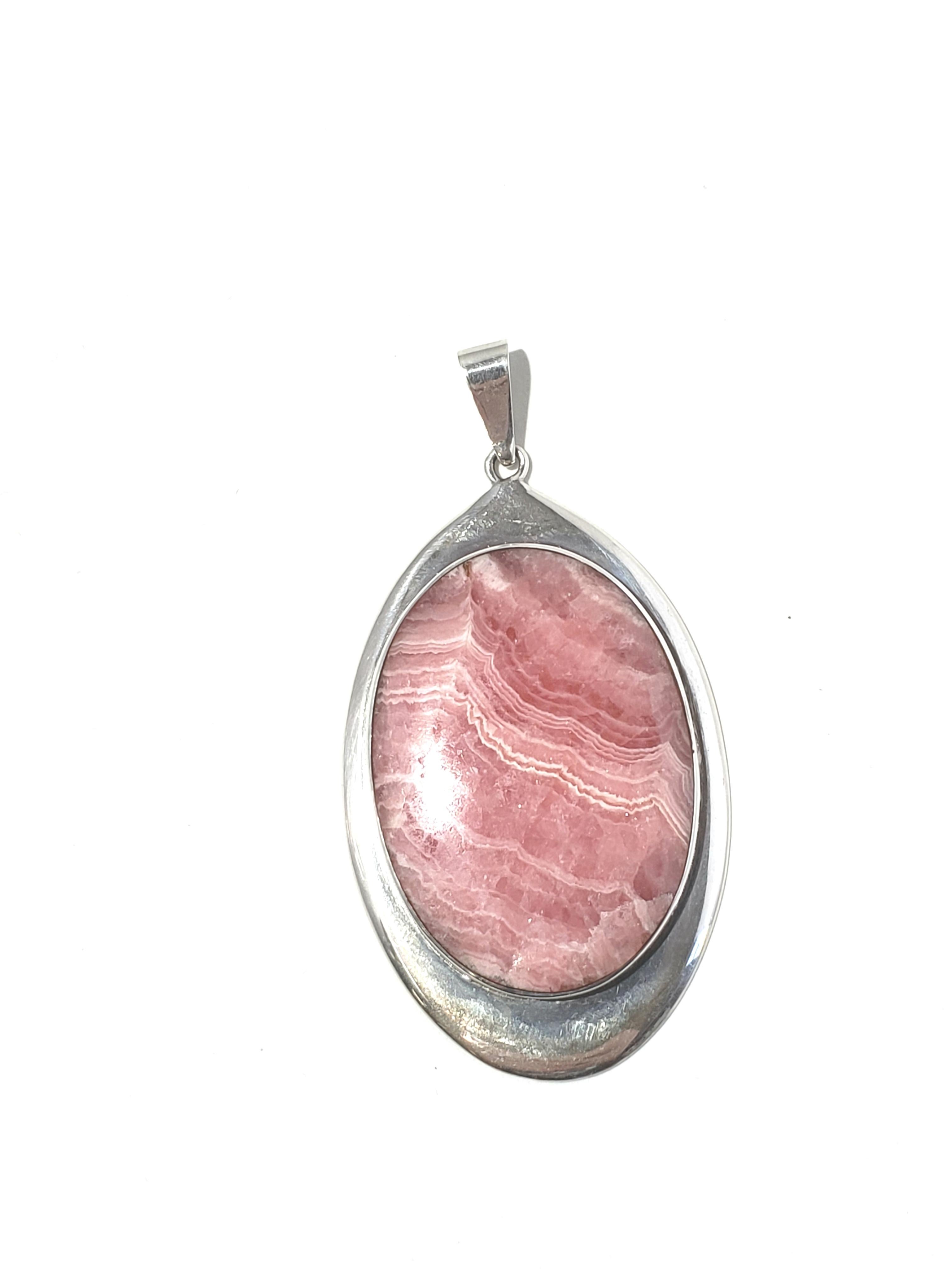 Sterling Silver Rhodochrosite Oval Pendant

This is a lovely sterling silver Rhodochrosite Oval Pendant.  

Measurements:  Pendant measures 2 and 1/4 inches in length, 1 and 5/16 inches in width.  Pendant hangs approx 2 1/2 inches from the top of