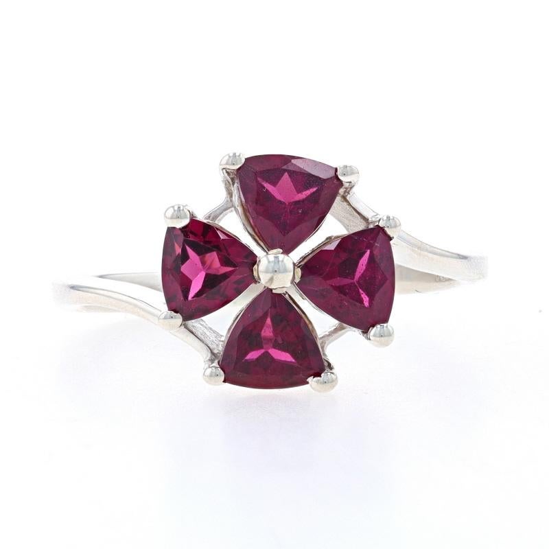 Size: 9
Sizing Fee: Up 1 size for $30 or Down 1 size for $30

Metal Content: Sterling Silver

Stone Information

Natural Rhodolite Garnets
Carat(s): 1.70ctw
Cut: Trillion
Color: Reddish Purple

Total Carats: 1.70ctw

Style: Cluster Bypass
Theme: