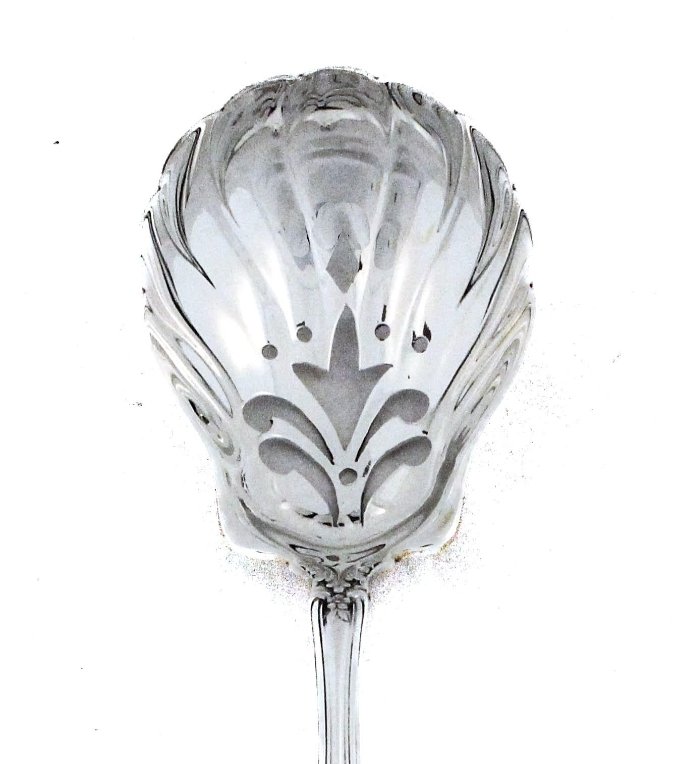 “This exquisite Tiffany & Co. Richelieu pierced serving spoon showcases the ornate elegance of the late 19th-century aesthetic. Crafted in sterling silver, the piece features intricate openwork and lavish Rococo-inspired detailing along the handle,