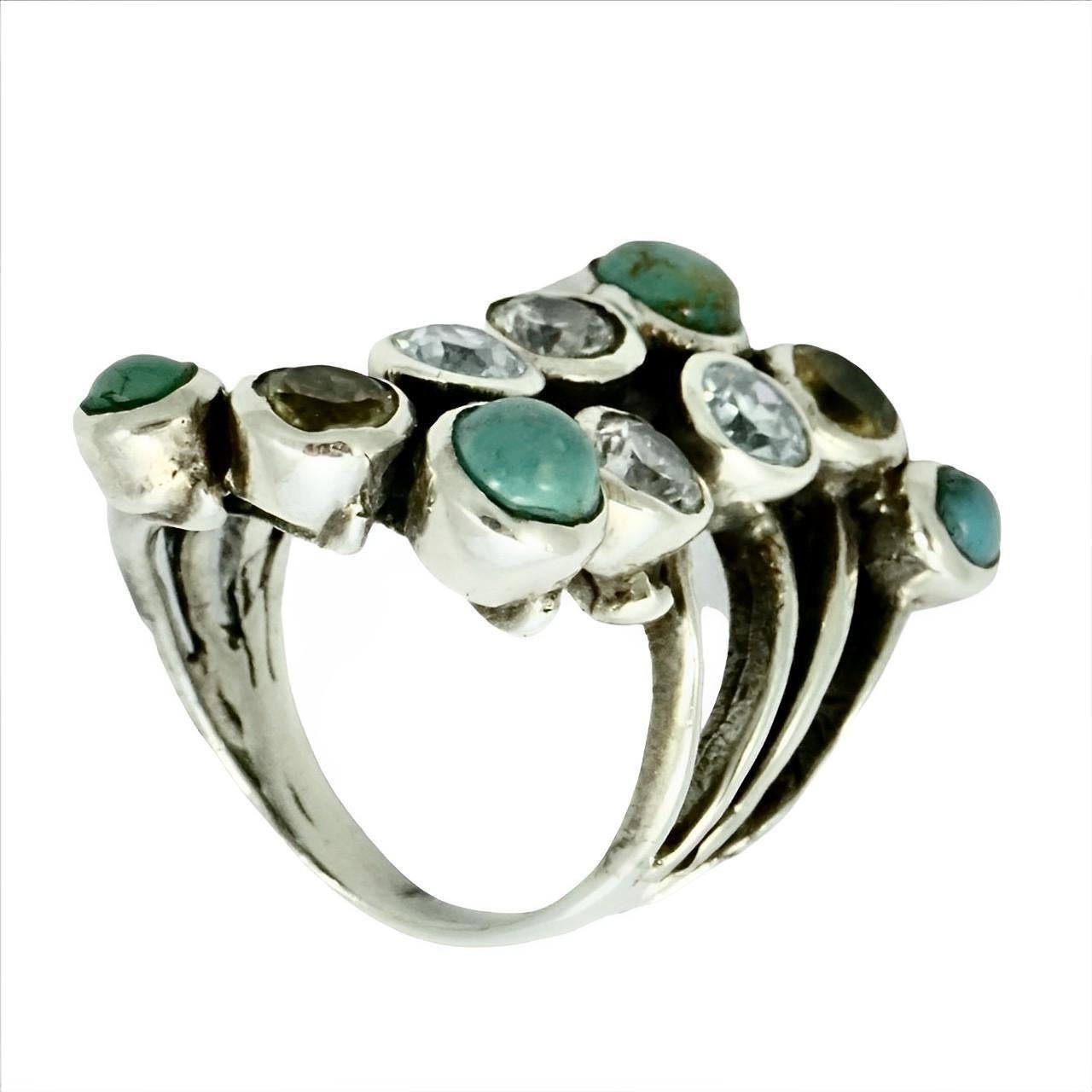 
Wonderful sterling silver ring set with turquoise, citrine, topaz and clear crystal stones. Ring size UK N 1/2, US 6 3/4, and measuring inside diameter approximately 1.8 cm / .7 inch. The front is approximately length 4 cm / 1.57 inches. The silver