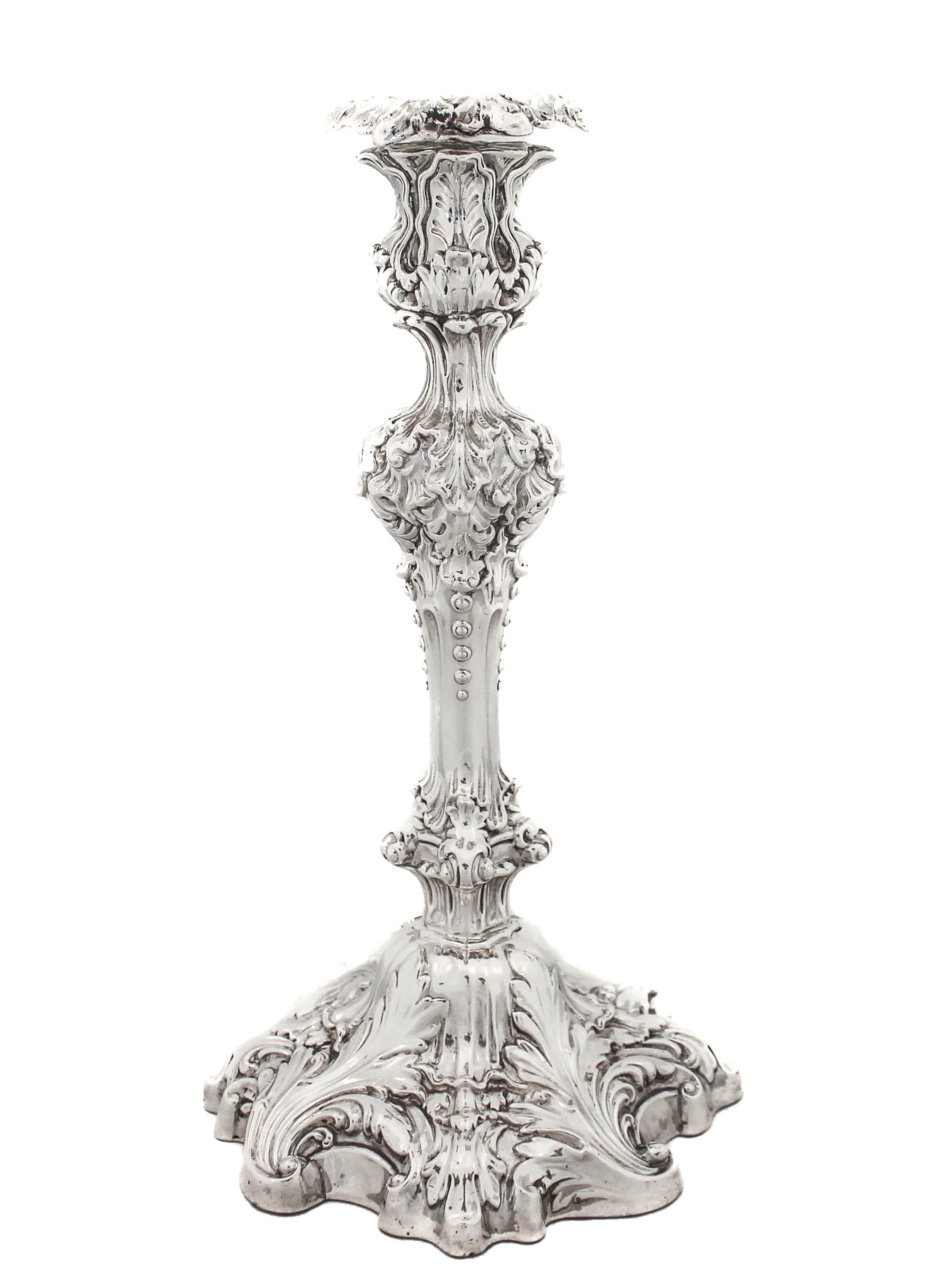 Being offered is a pair of sterling silver candlesticks by Frank W. Smith Silver.  They are designed in the Rococo style.  With their elaborate work and incredible detail, these candlesticks are show stoppers!! They are exceptionally heavy and have
