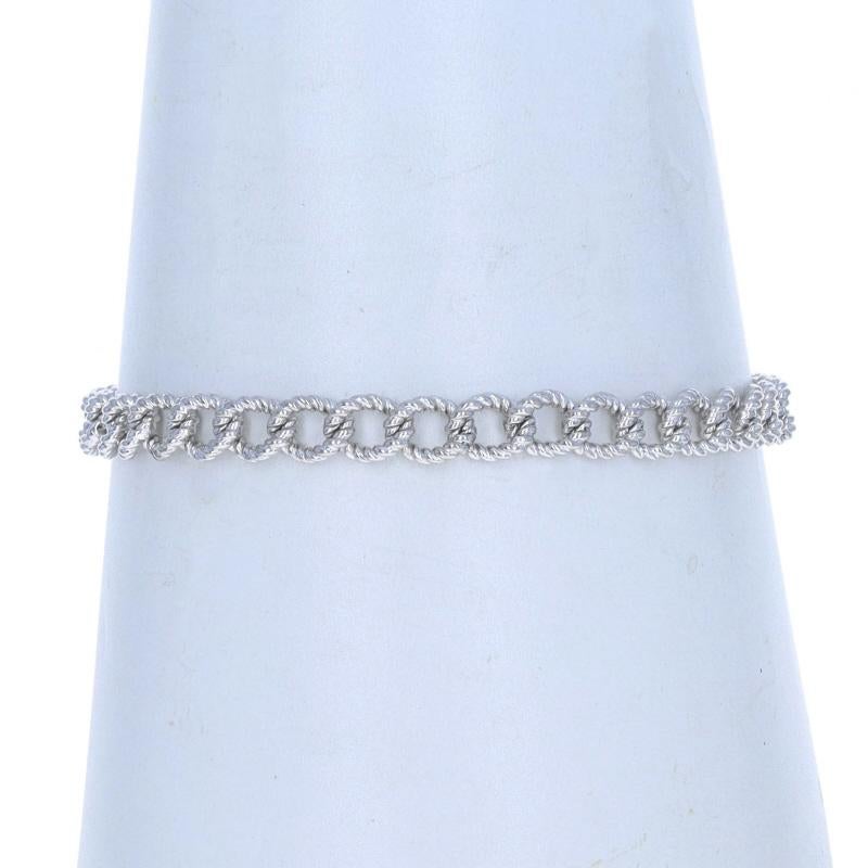 Metal Content: Sterling Silver

Chain Style: Rope-Textured Fancy Curb
Bracelet Style: Chain
Fastening Type: Spring Ring Clasp with Safety Chain

Measurements

Inner Circumference: 7 1/4
