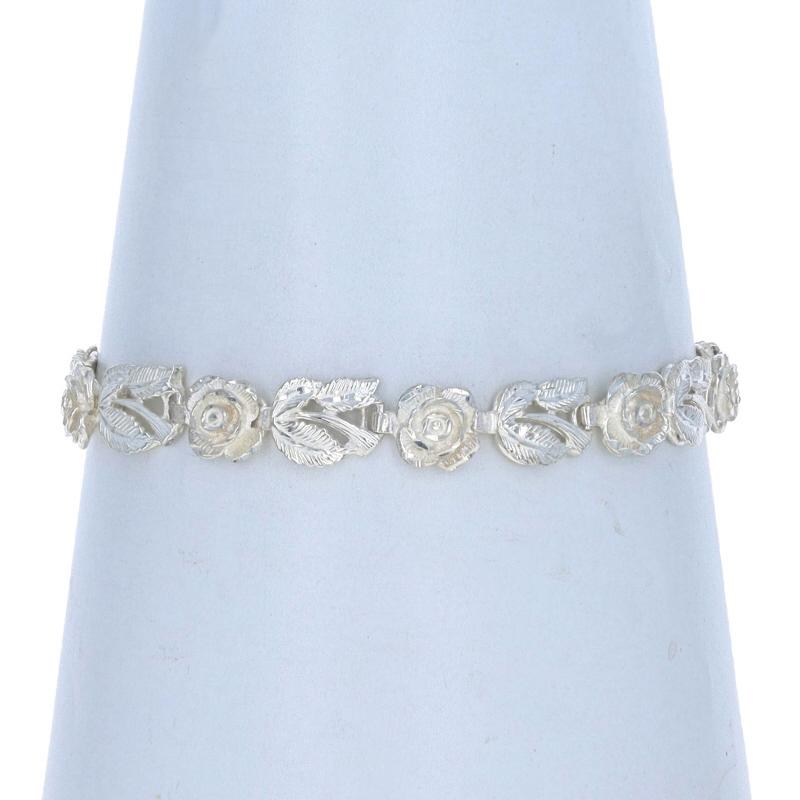 Metal Content: Sterling Silver

Style: Link
Fastening Type: Lobster Claw Clasp
Theme: Flowers, Rose Blossoms
Features: Etched Detailing

Measurements

Length: 7
