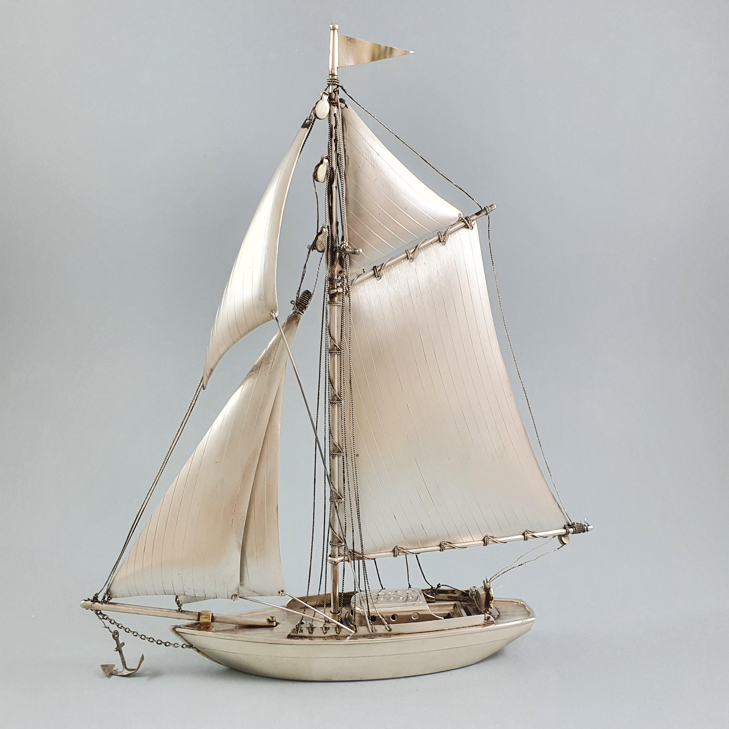 Beautiful sterling silver sailboat very finely worked.

Silver hallmark: Silver 970 

Length: 18.7 cm 
Height: 21 cm 
Weight: 143 grams