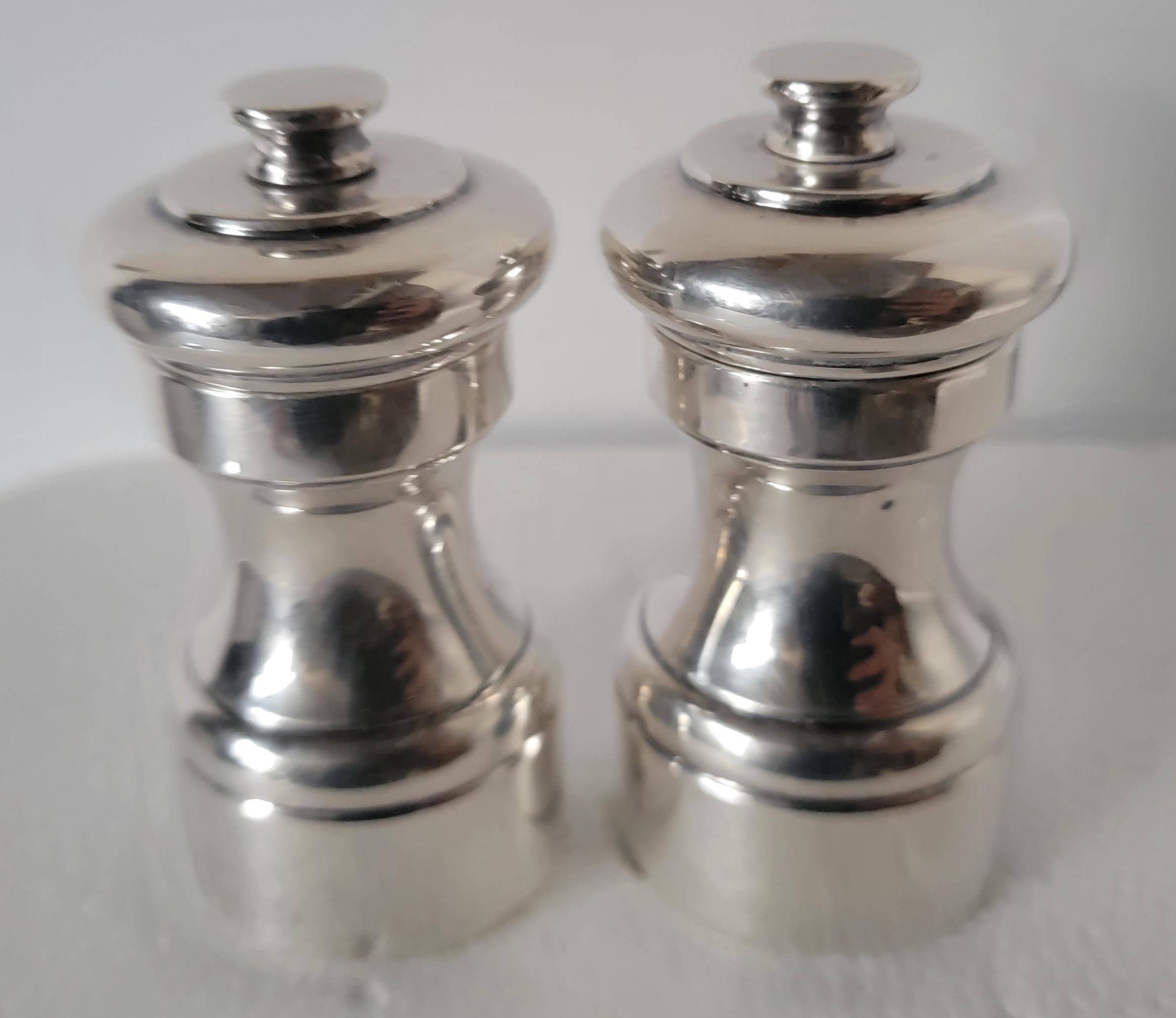 Very nice sterling silver salt and pepper grinders. Great Condition. Marked France.