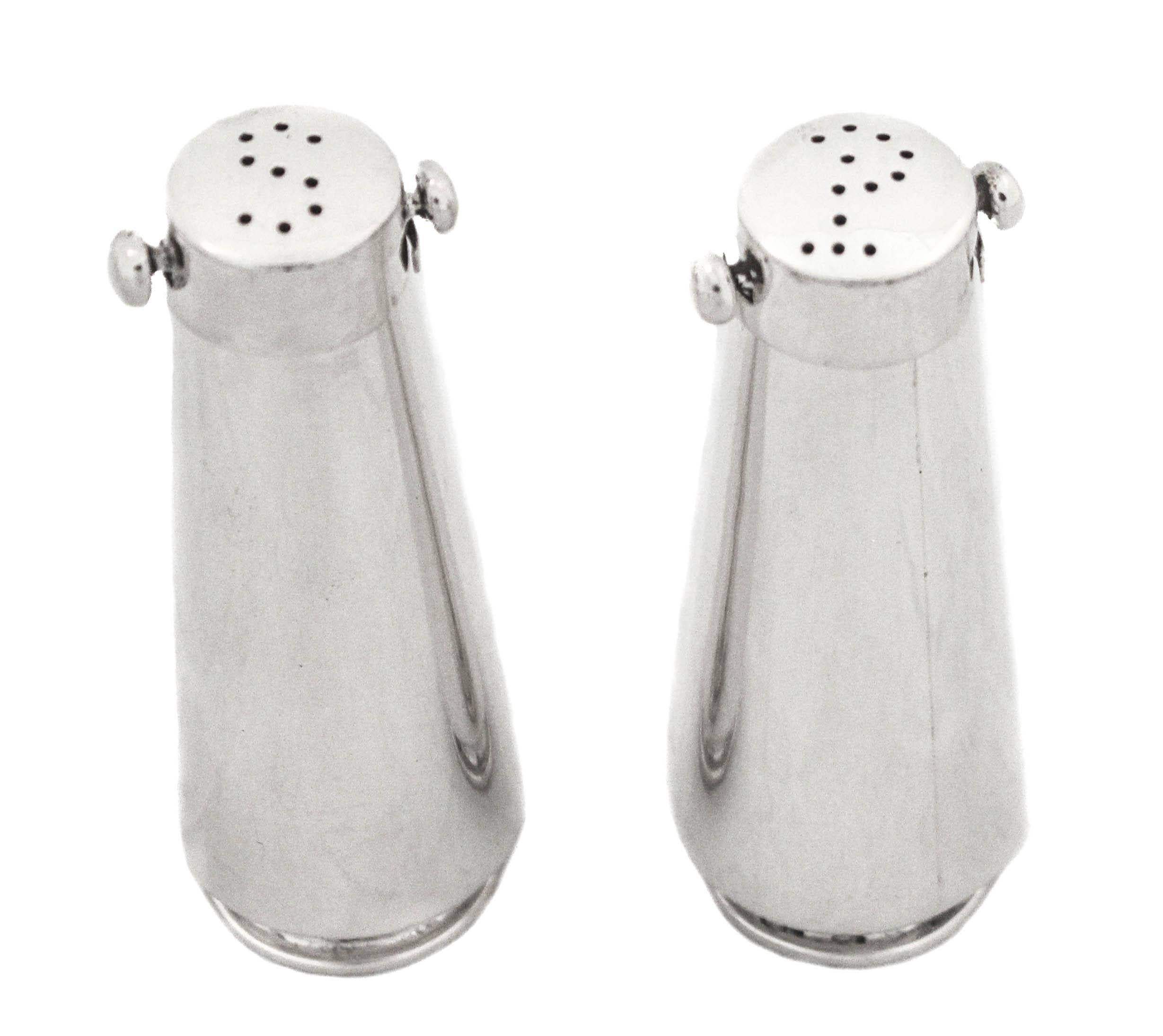 We are happy to offer you this pair of sterling silver Japanese salt shakers from the 1960s. The are uber-modern and sleek. A very unusual pair that are quintessential Mid-Century Modern. Japan is known for there edgy and sleek designs and this is