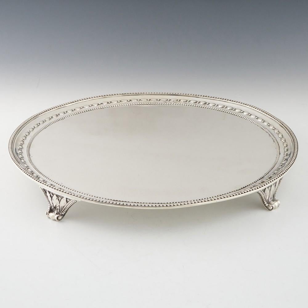 Heading : Sterling silver salver London 1876
Date : Hallmarked in London in 1876 for Hunt and Roskell
Period : Victoria
Origin : London, England
Decoration : Applied beaded rim with a band of corn and another beaded band. Four applied feet with