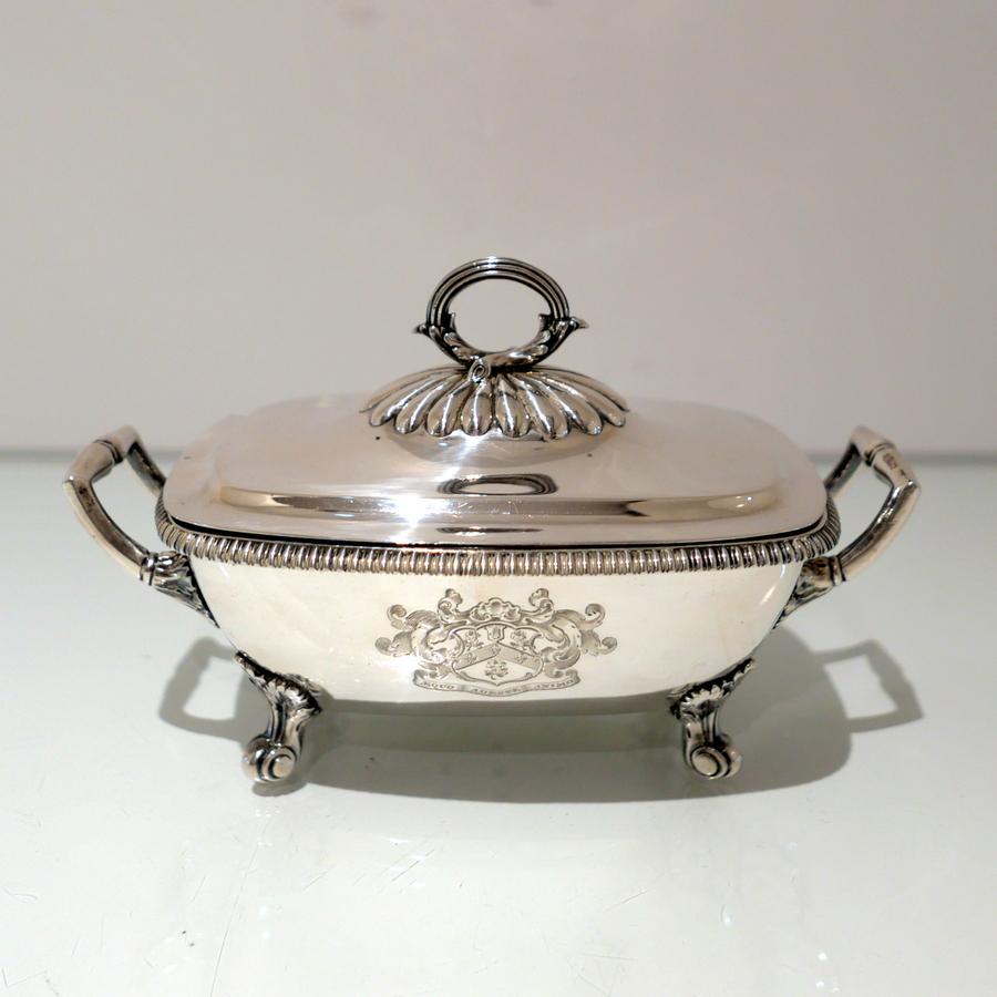 An incredibly fine rectangular shaped silver sauce tureen and cover decorated with a splendid looking gadroon border below which sits a delightful hand engraved contemporary armorial for importance. The detachable lid has an elegant ‘wreath’ style