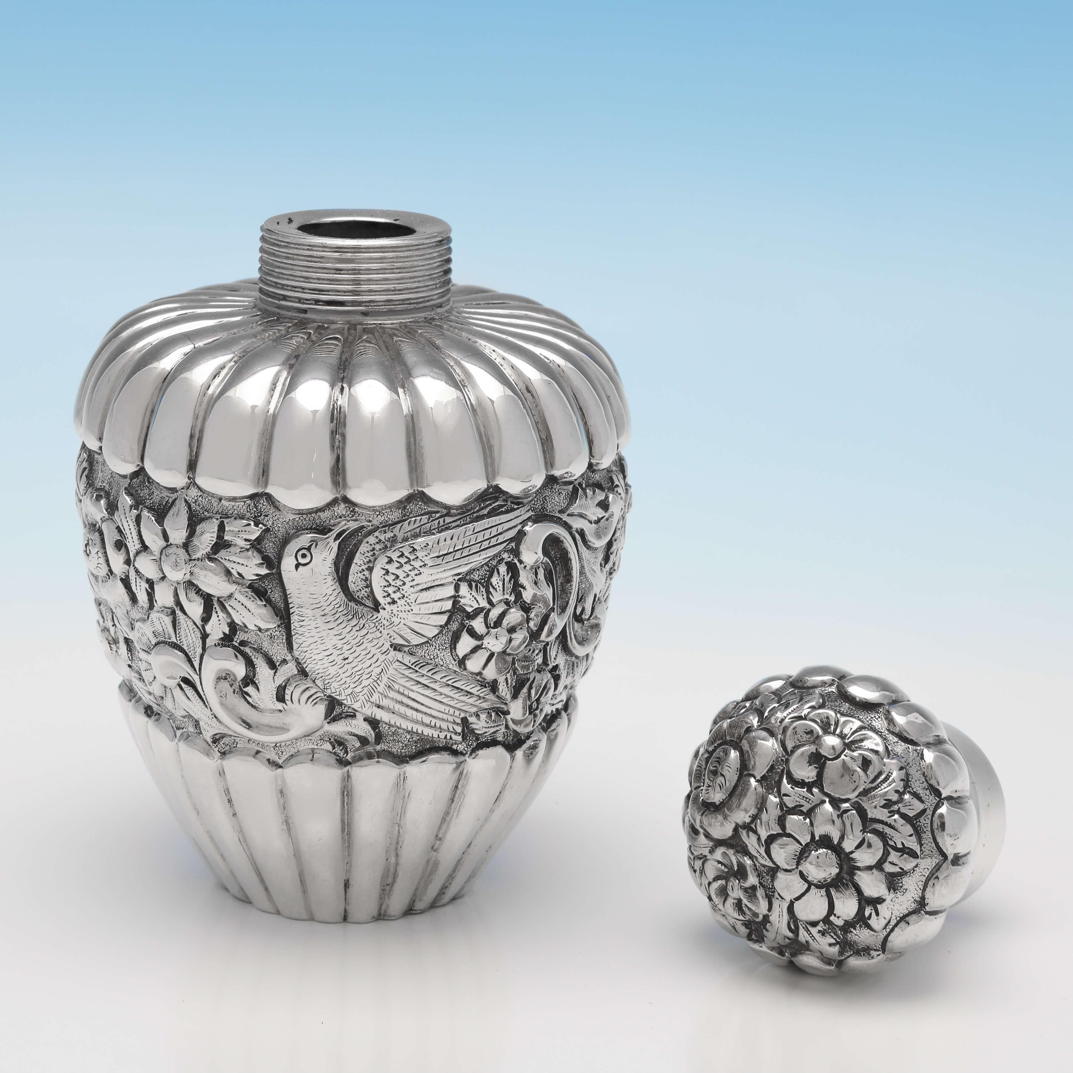 Hallmarked in Edinburgh in 1888 by Marshall & Sons, this very attractive, Antique Sterling Silver Scent Bottle, is ornate in design, featuring a chased band of decoration around the body and lid, and fluted detailing. The scent bottle measures