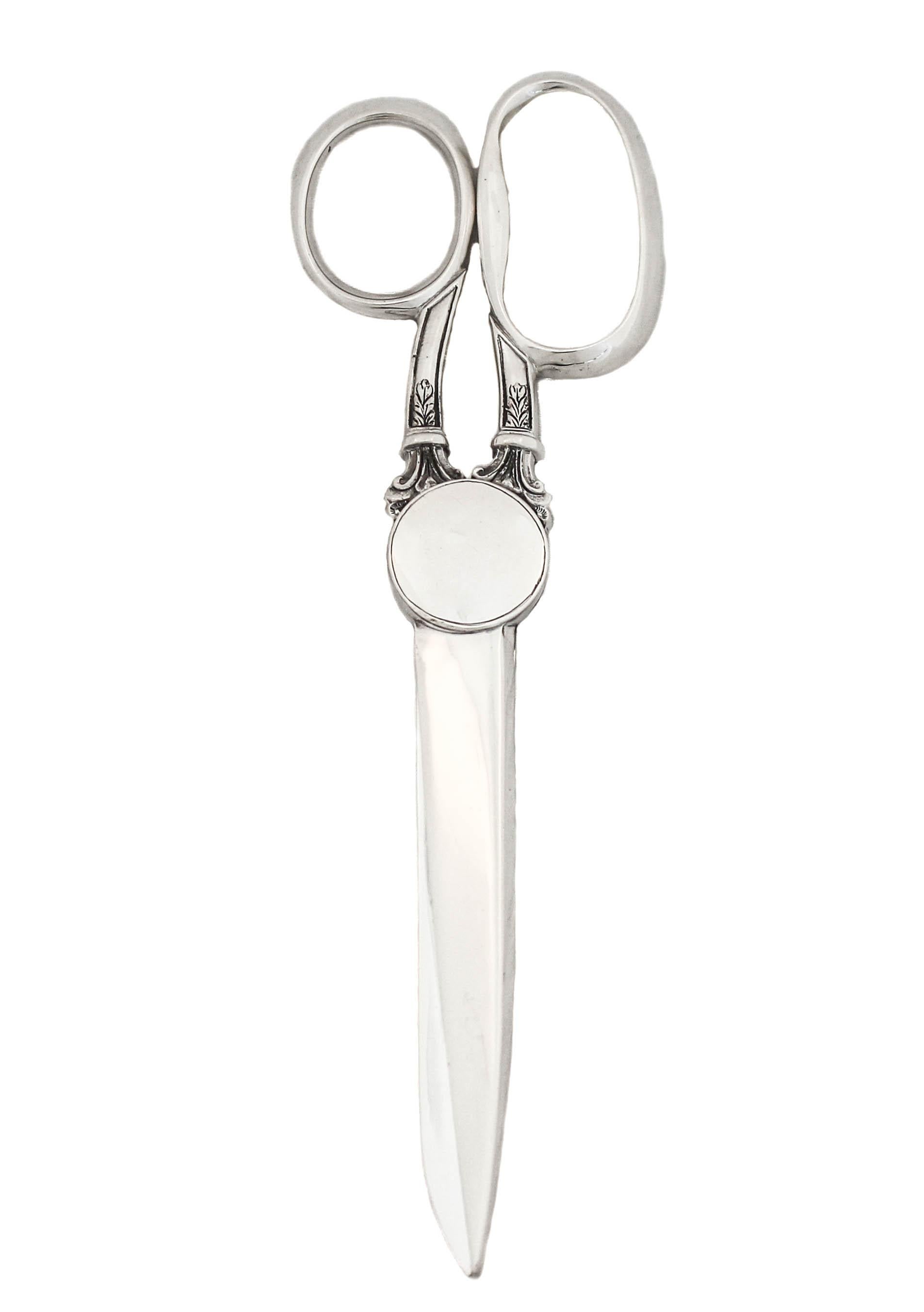 Being offered is a pair of sterling silver scissors in their original presentation box.  Made in England, they have that understated English look that is hard to miss.  What makes them so special is that they are in the original box from the