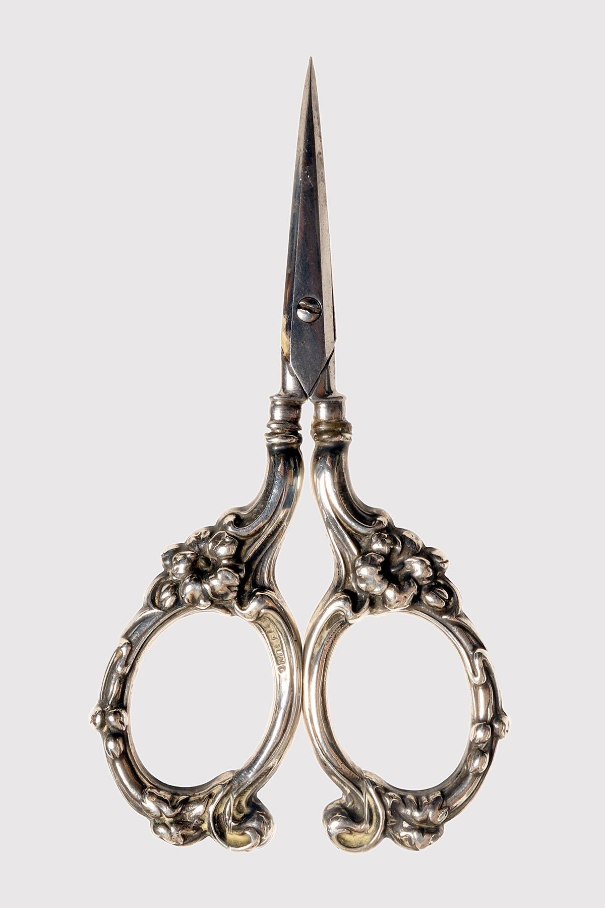 Vintage Sterling Silver Grape Shears/Scissors by Watson of Attleboro, MA. They were manufacturers of silver novelties from 1880 onwards. These grape shears feature floral style handles, depicting flowers, made of 925/1000 sterling silver and German