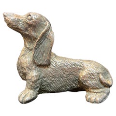 Sterling Silver Sculpture of a Long Haired Dachshund Dog with a Cute Expression