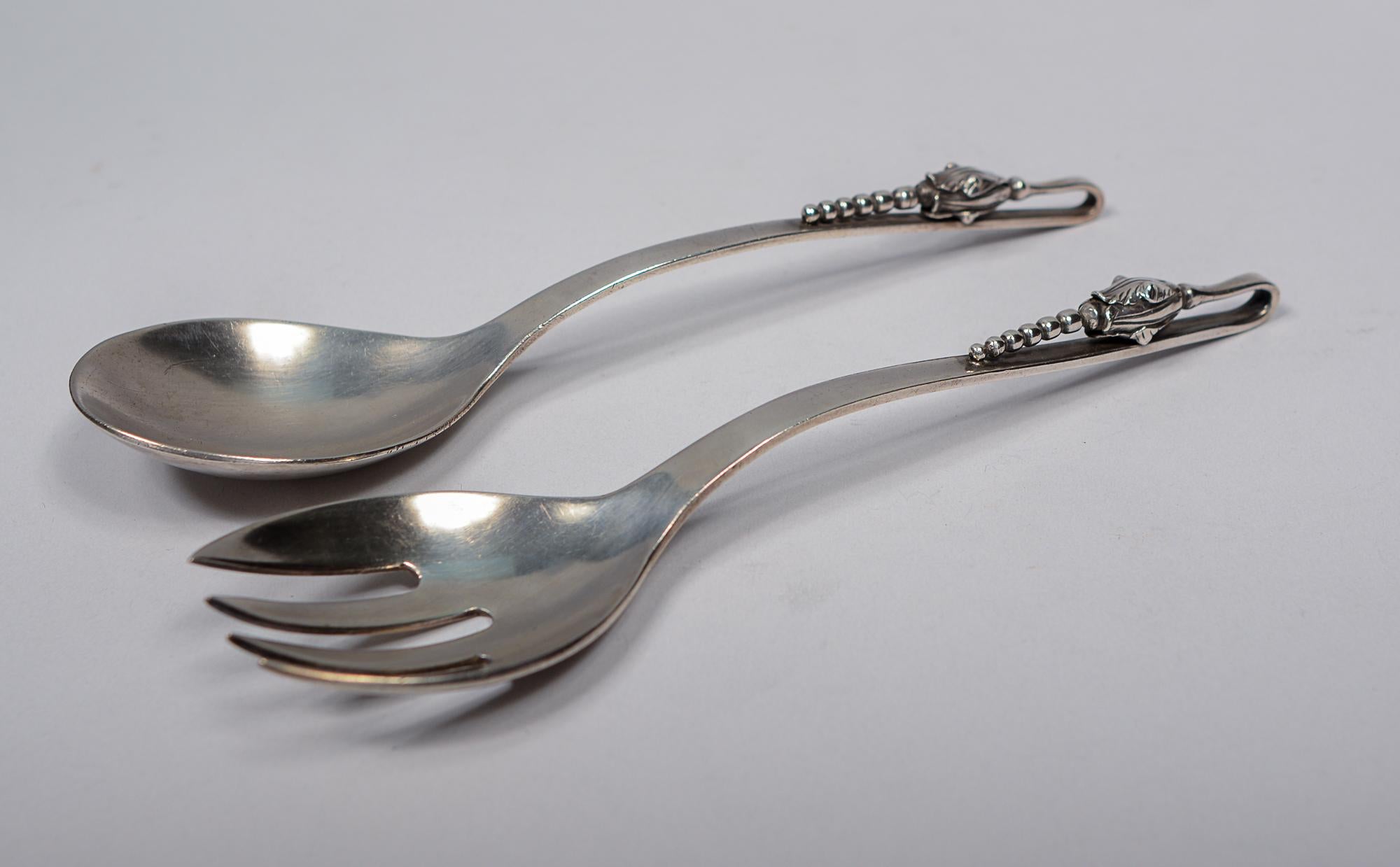 Pair of sterling silver servers by Sanborns of Mexico. These have an art nouveau Scandinavian style design. These have a lot of weight. They were used and have nicks on the edges and scratches.