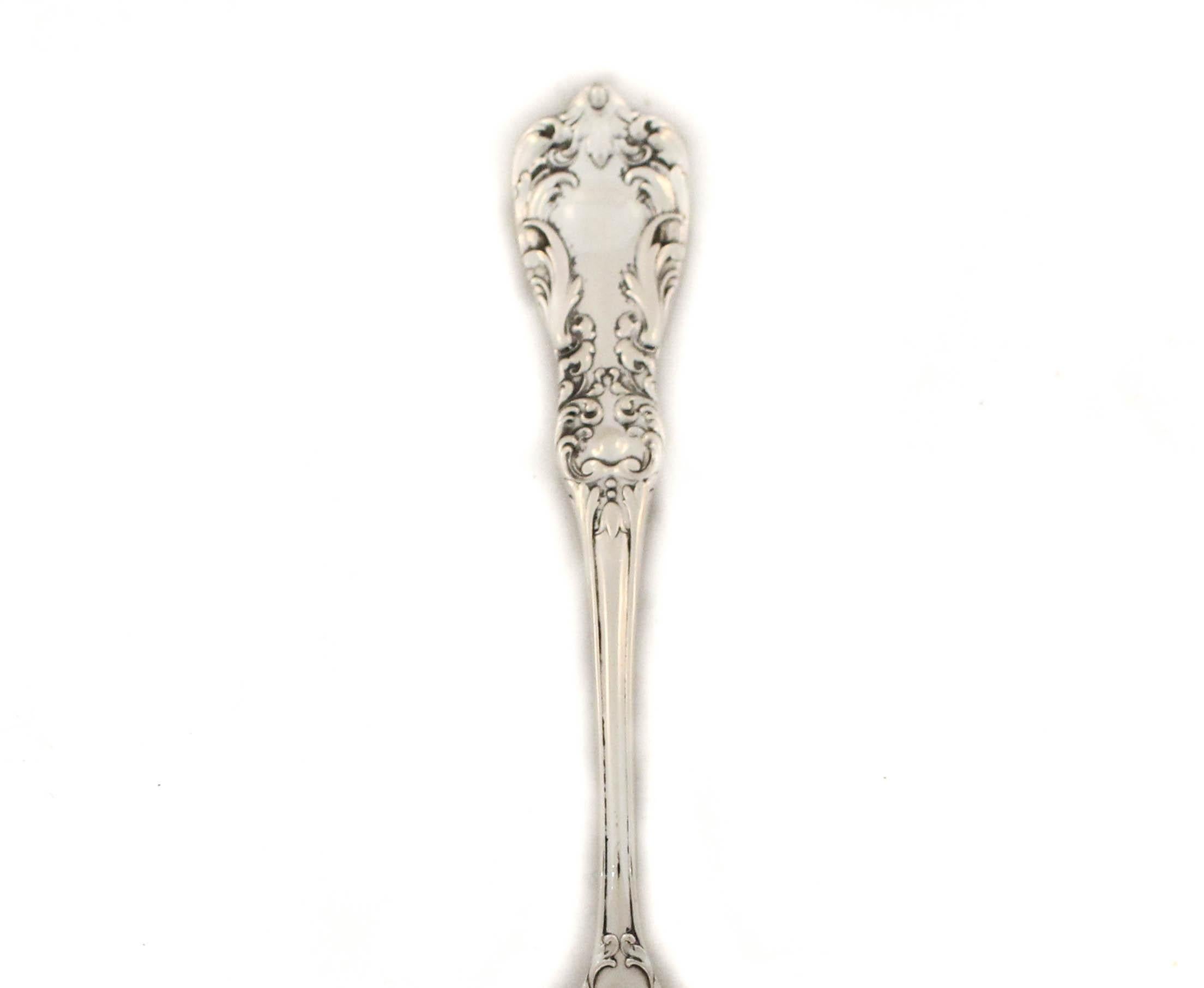 Being offered is a sterling silver serving spoon by Saart Brothers Silver in the “No. 1” pattern of 1900.  The handle is beautifully decorated in the Victorian style while the bowl is sleek and without decoration.  The bowl is deep and can scoop out