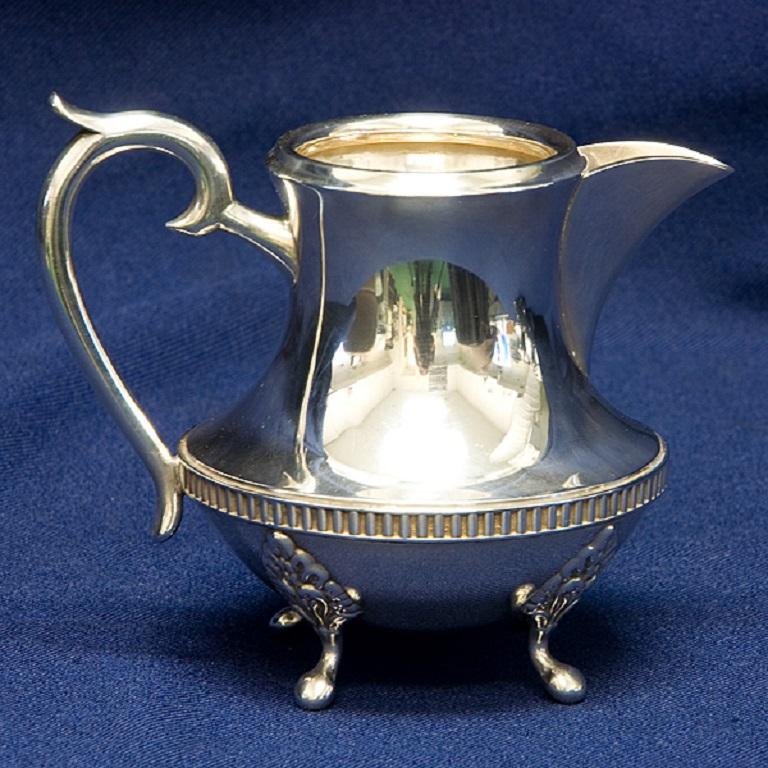 Beautiful Ornate 3 pc Sterling Silver .950 Coffee Pot, Sugar Bowl w/lid and Creamer 41.93 oz troy. The segmented banding around the waist of each item is especially attractive and unique. Coffee Pot 23.60 oz troy, Sugar Bowl w/lid 10.71 oz troy and
