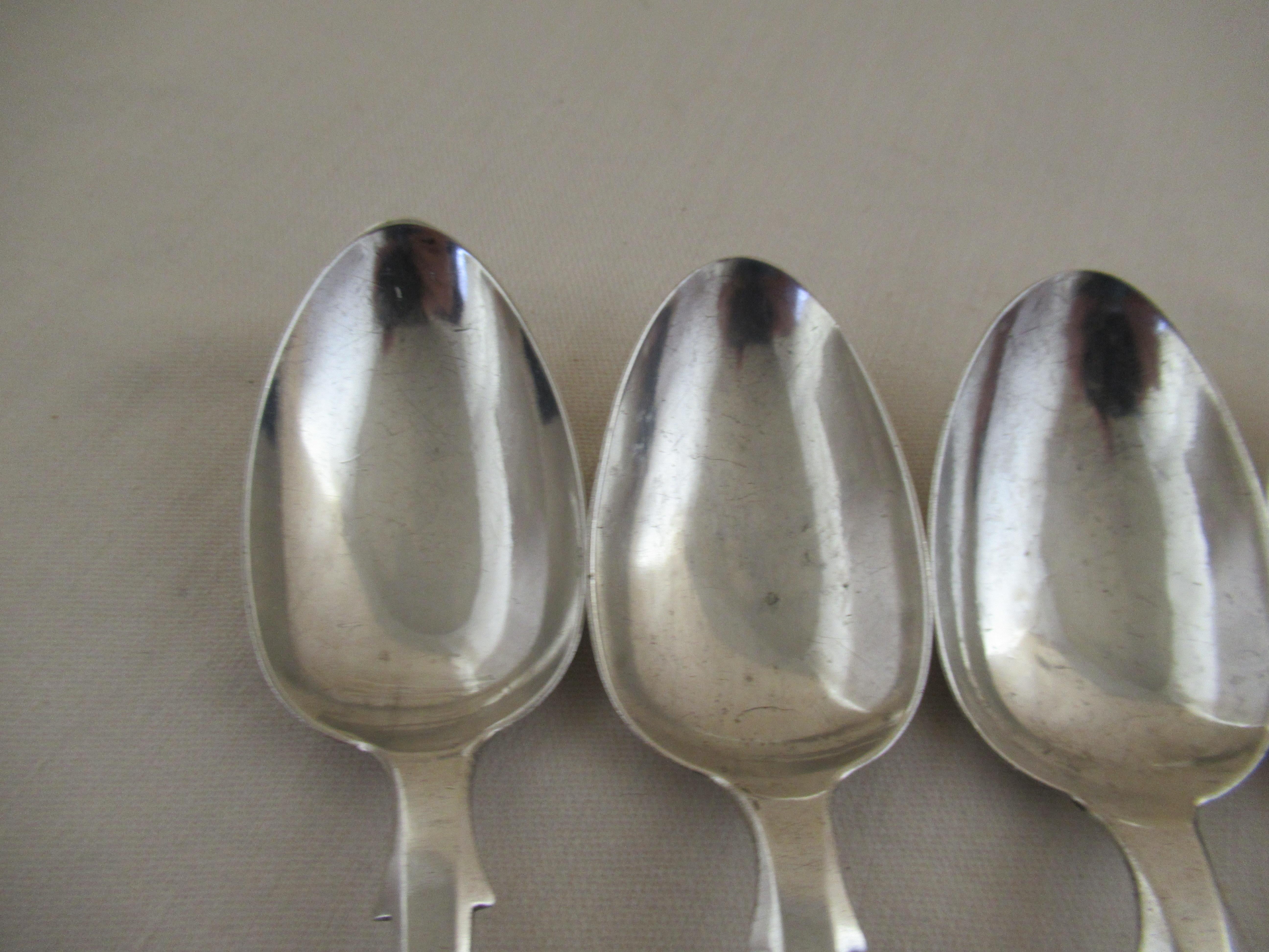 Sterling silver - set of 5 - large kings pattern teaspoons
The hallmarks show that they were made in Edinburgh, Scotland, by
 Millidge & Son.
The hallmarks were applied by the Edinburgh Assay Office:-
Castle & Thistle - Edinburgh Assay Office