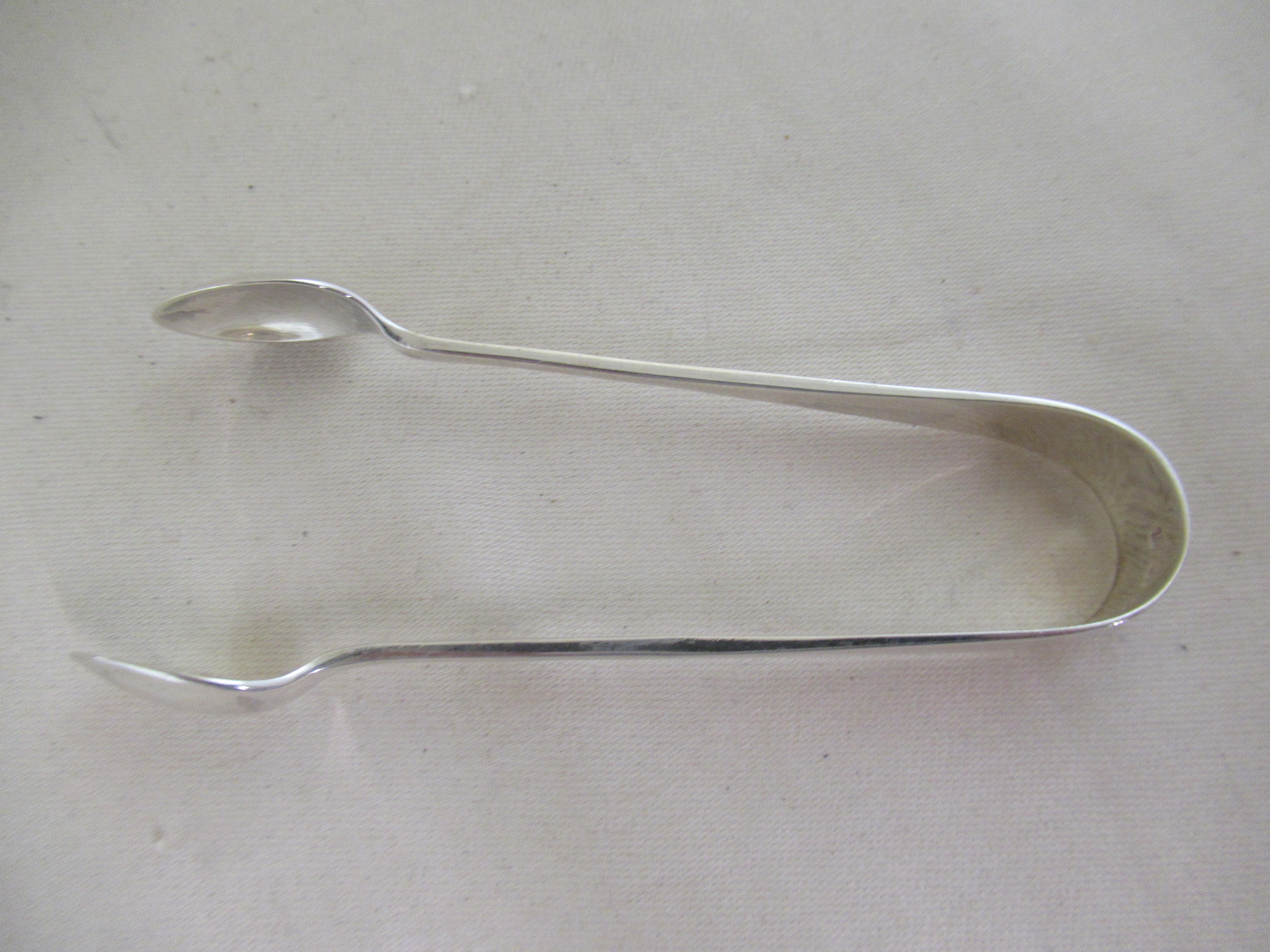 Juego de 6 cucharas y pinzas de plata de ley con diseño moderno Hallmarked:-Sheffield 1934 Silver en venta