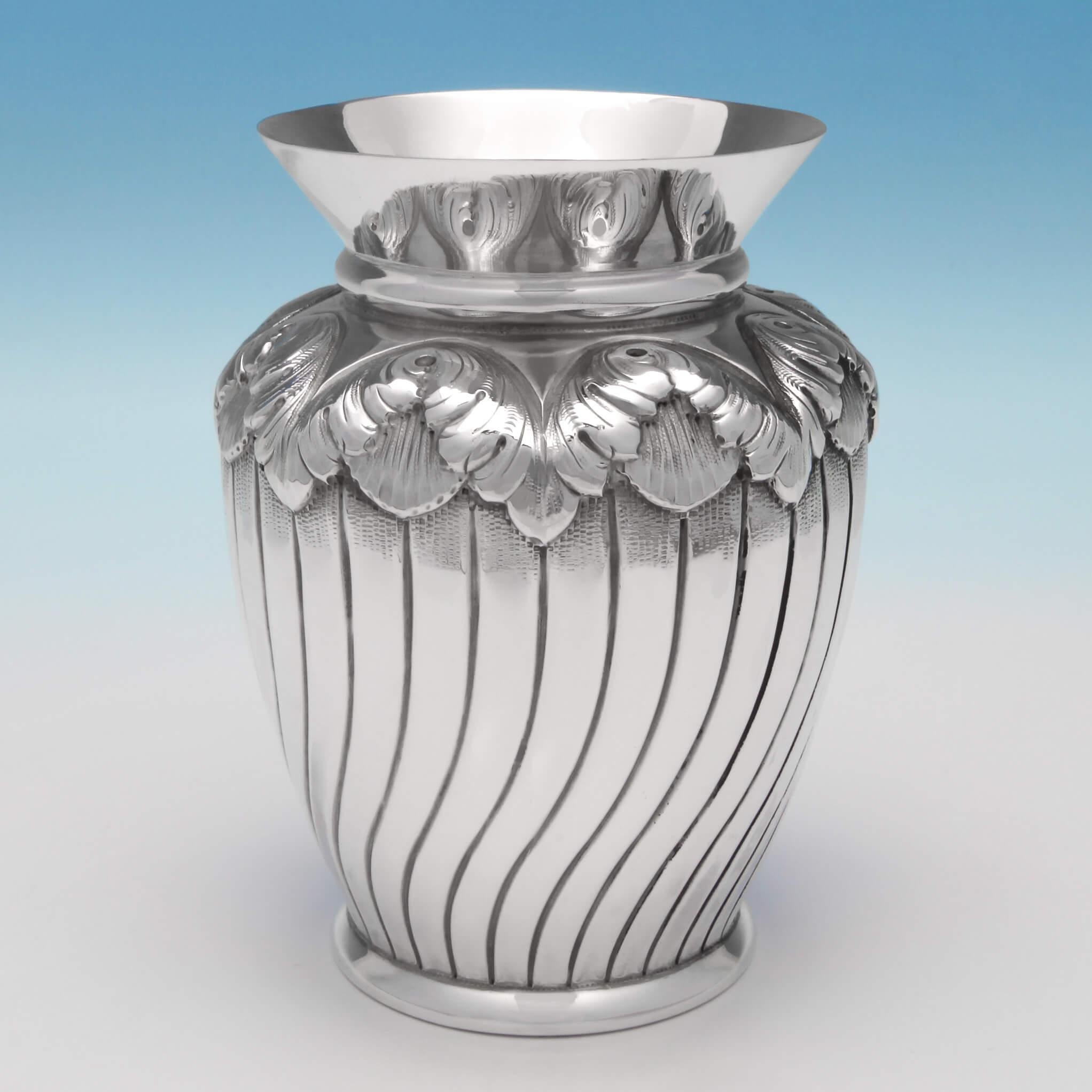 Hallmarked in London in 1893 by Edward Hutton, this very attractive, Antique, Victorian, Sterling Silver Set of Four Vases has acanthus decoration, and swirled fluting. Each vase measures 4.5