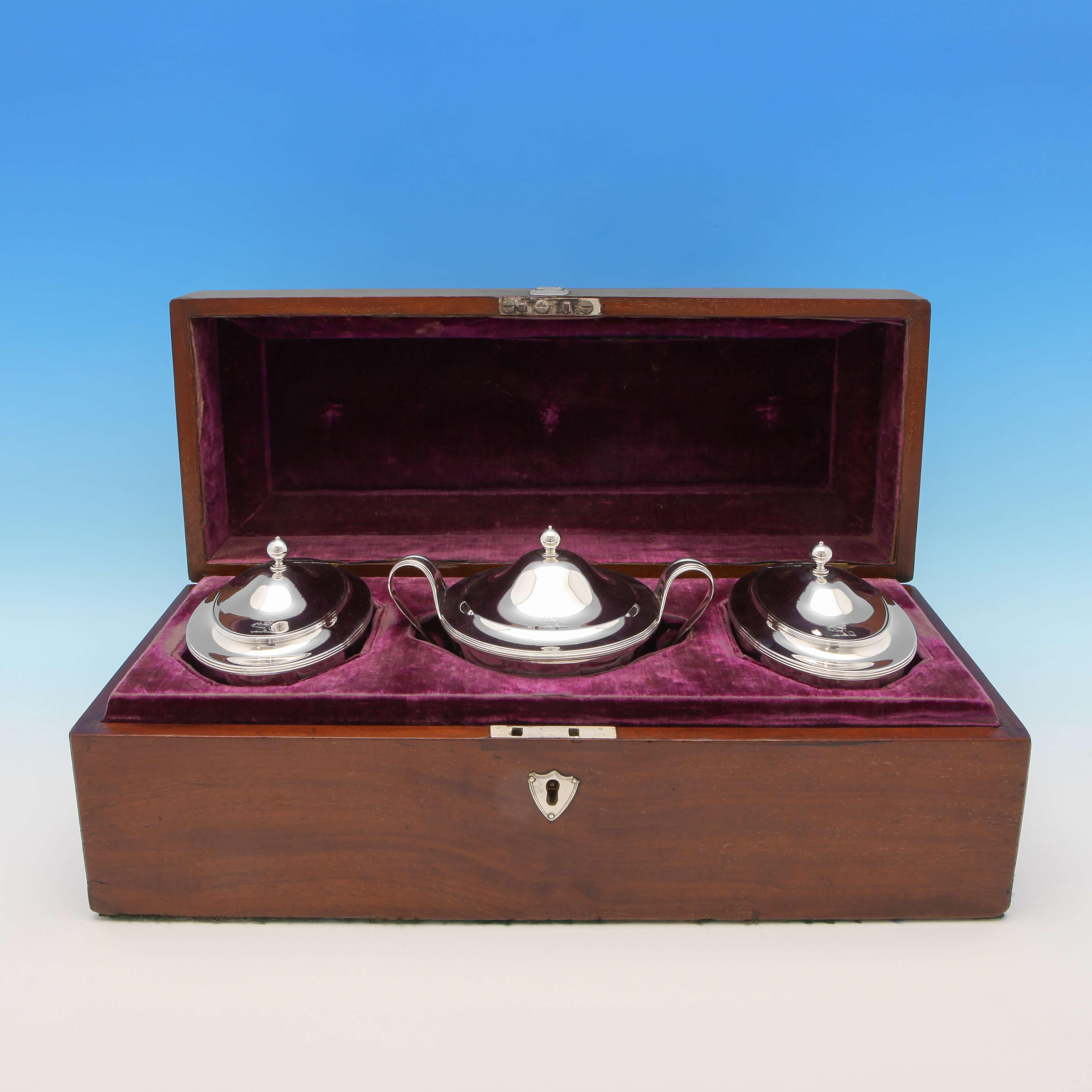 Hallmarked in London in 1797 by Robert Sharp, this rare and exceptional quality, George III, antique sterling silver tea caddy set, comprises two oval tea caddies and a sugar caddy, all presented in the original wooden box, and featuring reed