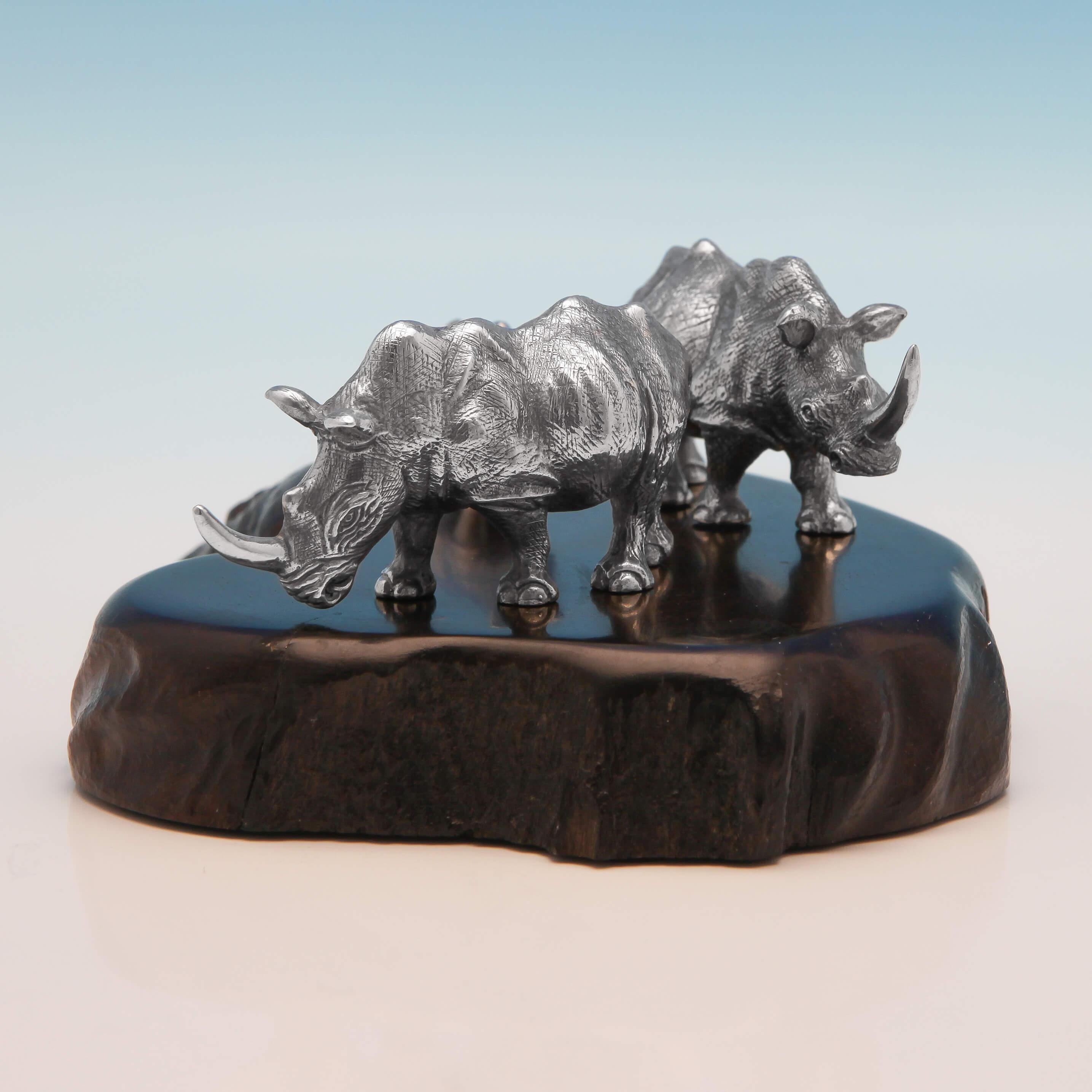 Hallmarked in 1997 by Patrick Mavros, this fabulous sterling silver set of three Rhinoceroses, stand on an African blackwood base and are realistically modelled. The base measures 6