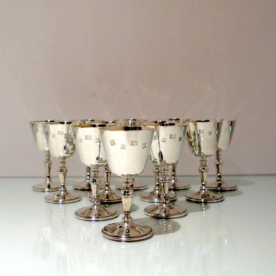 A delightful suite of twelve sterling silver wine goblets designed with elegant tapering bowls which sit on a stylish circular raised pedestal foot.

Weight: 58.8 troy ounces/1830 grams

Height: 5.5 inches/13.9cm

Diameter: 2.75 inches/7cm