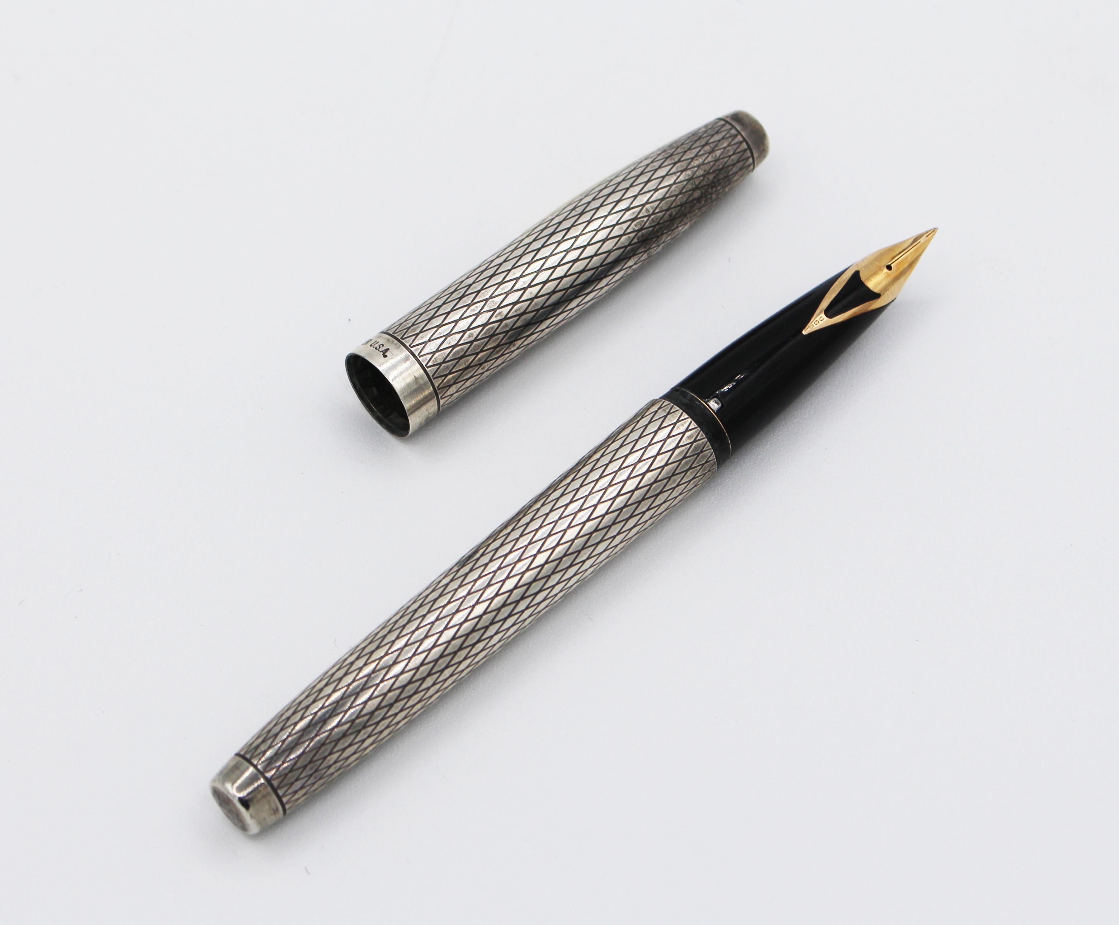 A Sheaffer Imperial fountain pen, sterling silver, 14k nib #585. USA. Diamond pattern, c.1970s. Normal wear commensurate with age and use. Crown insignia. 5 1/8