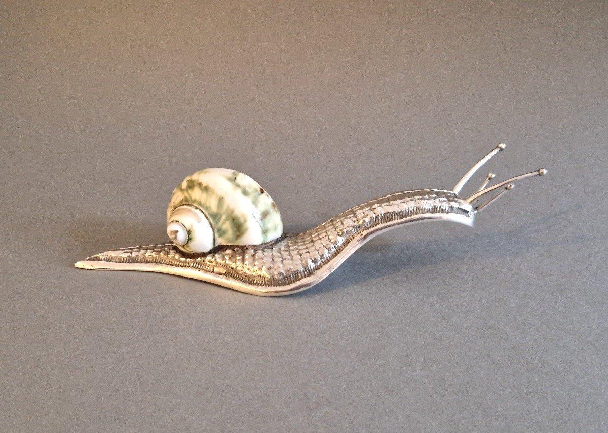 Encantador caracol de concha y plata de ley

Obra portuguesa de mediados del siglo XX 
Sello de plata Águila y 925 
Longitud: 18 cm 
Altura: 4 cm