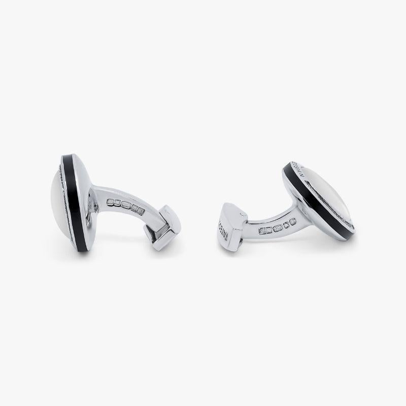 Sterling Silver Signature Round Cufflinks with White Mother of Pearl

Smooth white mother of pearl domes sit within our round, rhodium plated sterling silver frame, with an engraved diamond pattern and black-coloured enamel edge to accentuate the