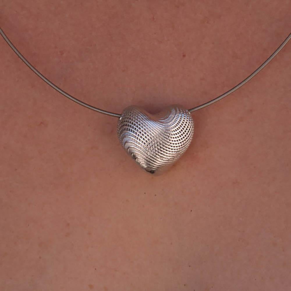 Small Heart Pendant -Sterling Silver  -
PENDANT ONLY (you can add a Stainless Steel coil for 100$)

This Sterling Silver Heart Pendant is a unique pendant with a beautiful wavy texture. Made in 3D technique - contemporary design and yet elegant and