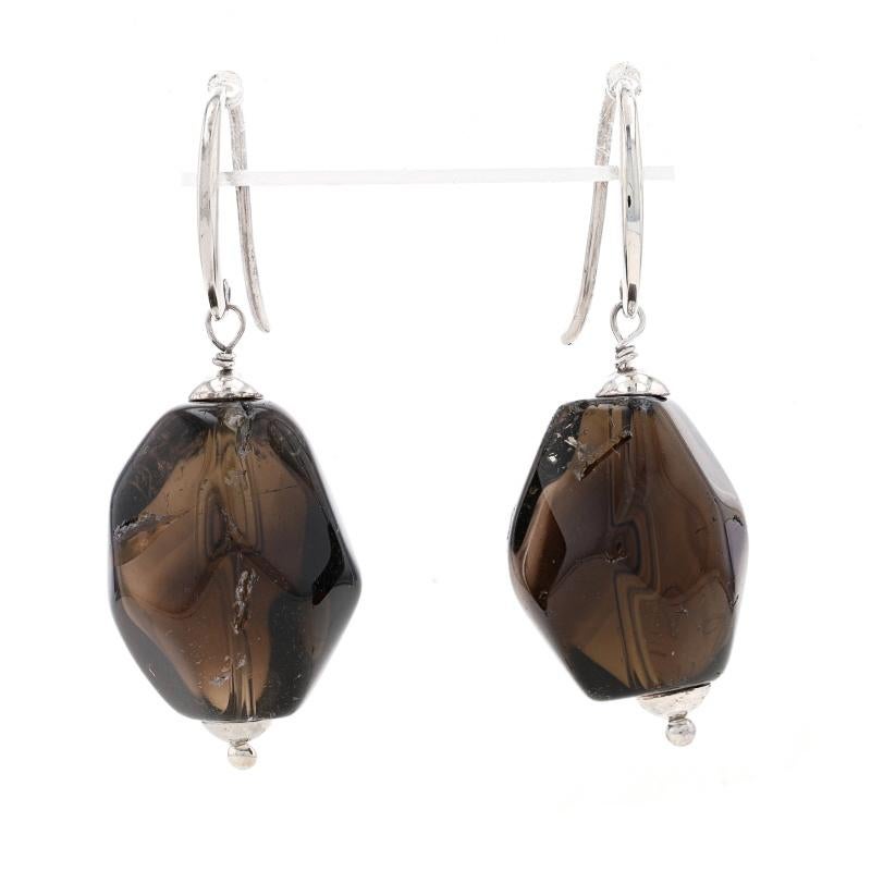 Metal Content: Sterling Silver

Stone Information
Natural Smoky Quartz
Cut: Tumbled
Color: Brown

Style: Dangle
Fastening Type: Fishhook Closures

Measurements
Tall: 1 5/8