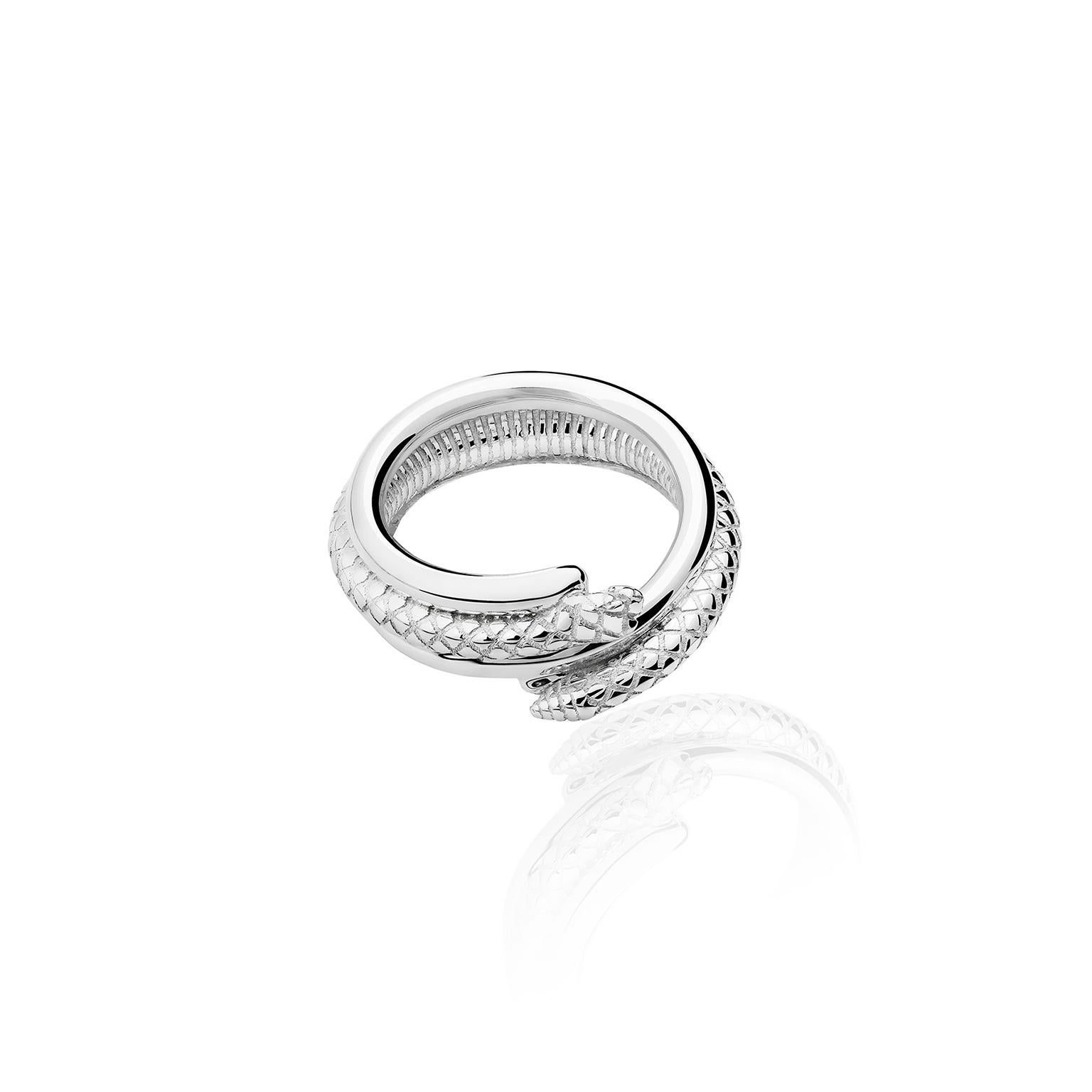 The Snake Ring of the Animales Collection by TANE is made of sterlingsilver, its ring shape intersperses a polished silver spiral with a perfectly sculpted snake, which wraps itself seductively around the body.  Handmade in Mexico.

TANE, the
