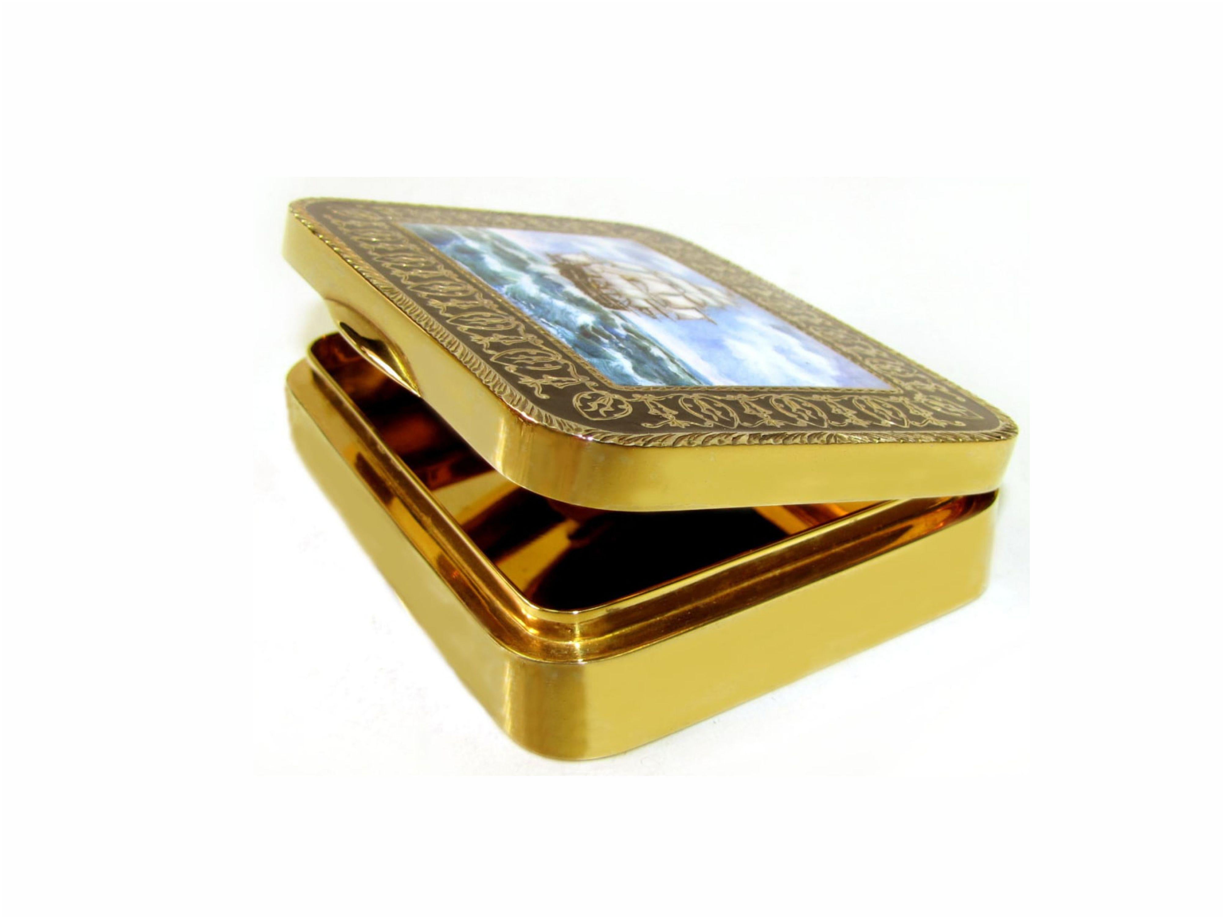 Sterling Silver Snuff box with rounded corners gold plated with Baroque style engraved and fire enameled frame with fine hand painted enameled miniature by painter Renato Dainelli depicting a sailing ship. Size cm. 7 x 9,5 x 2,3. Weight gr. 250.