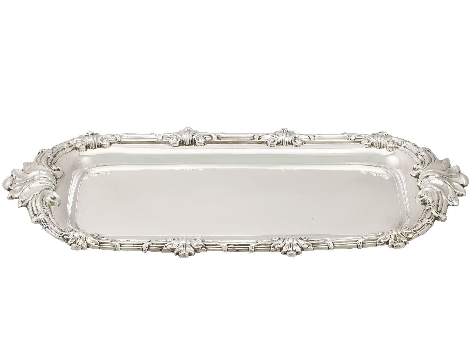 An excellent, fine and impressive antique Georgian English sterling silver snuffer/pen tray; an addition to our ornamental silverware collection.

This exceptional antique George III sterling silver tray has a plain rectangular form with rounded