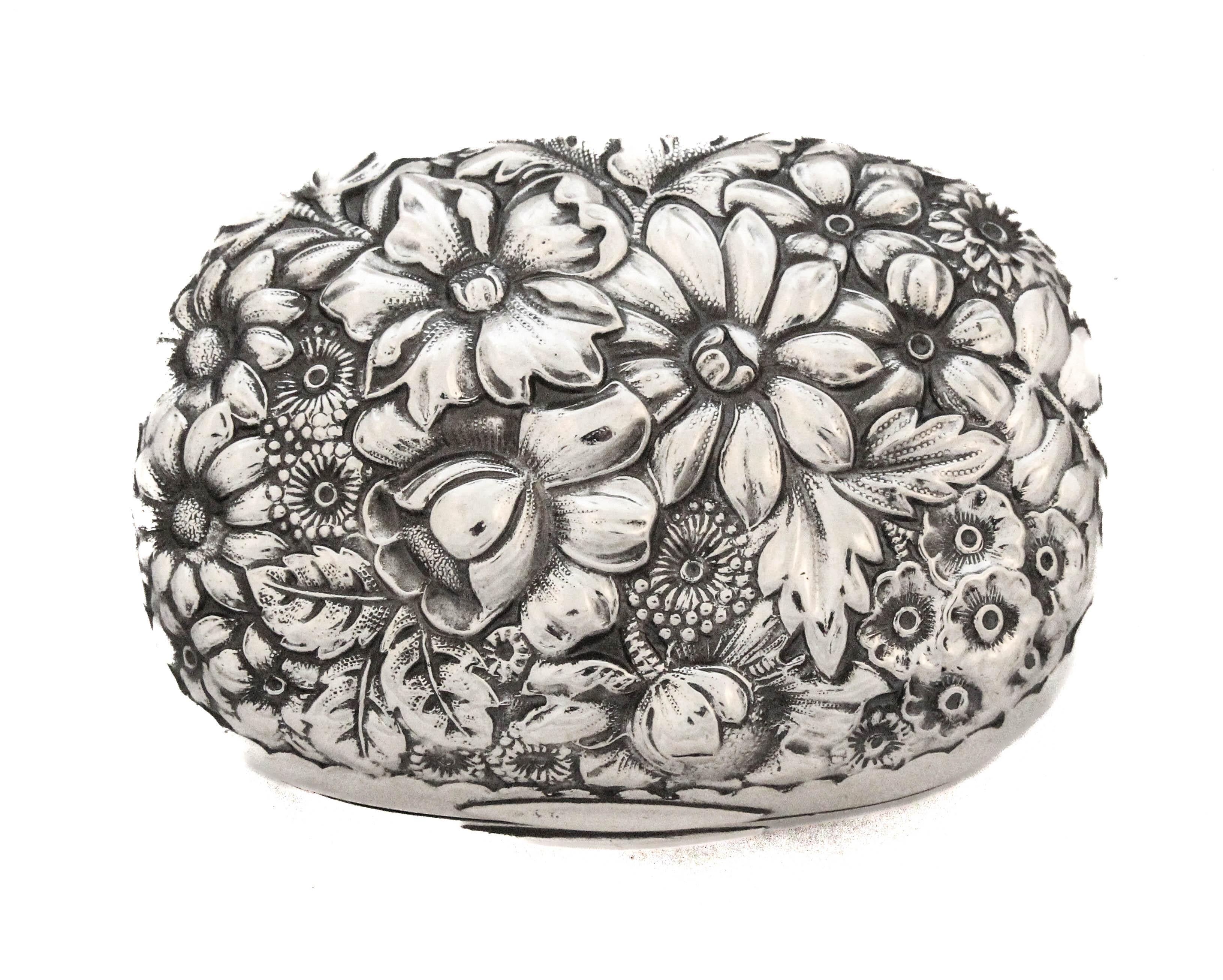 A Gorham sterling silver soap box, date marked for 1903. Crafted in a richly detailed “Repousse” floral and scroll motif, this elegant piece exemplifies the ornate artistry of early 20th-century American silver-work. The top features a domed hinged