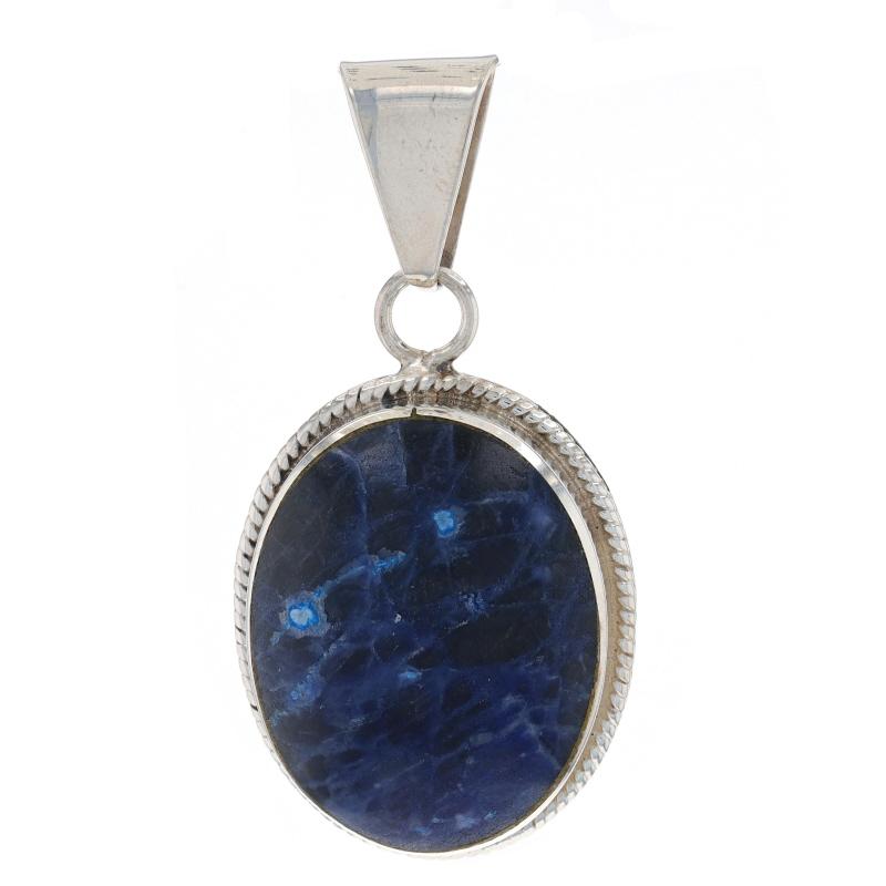 Metal Content: Sterling Silver

Stone Information
Natural Sodalite
Cut: Oval Cabochon
Color: Blue

Style: Solitaire
Features: Rope-Textured Border Detailing

Measurements
Tall (from stationary bail): 1 31/32