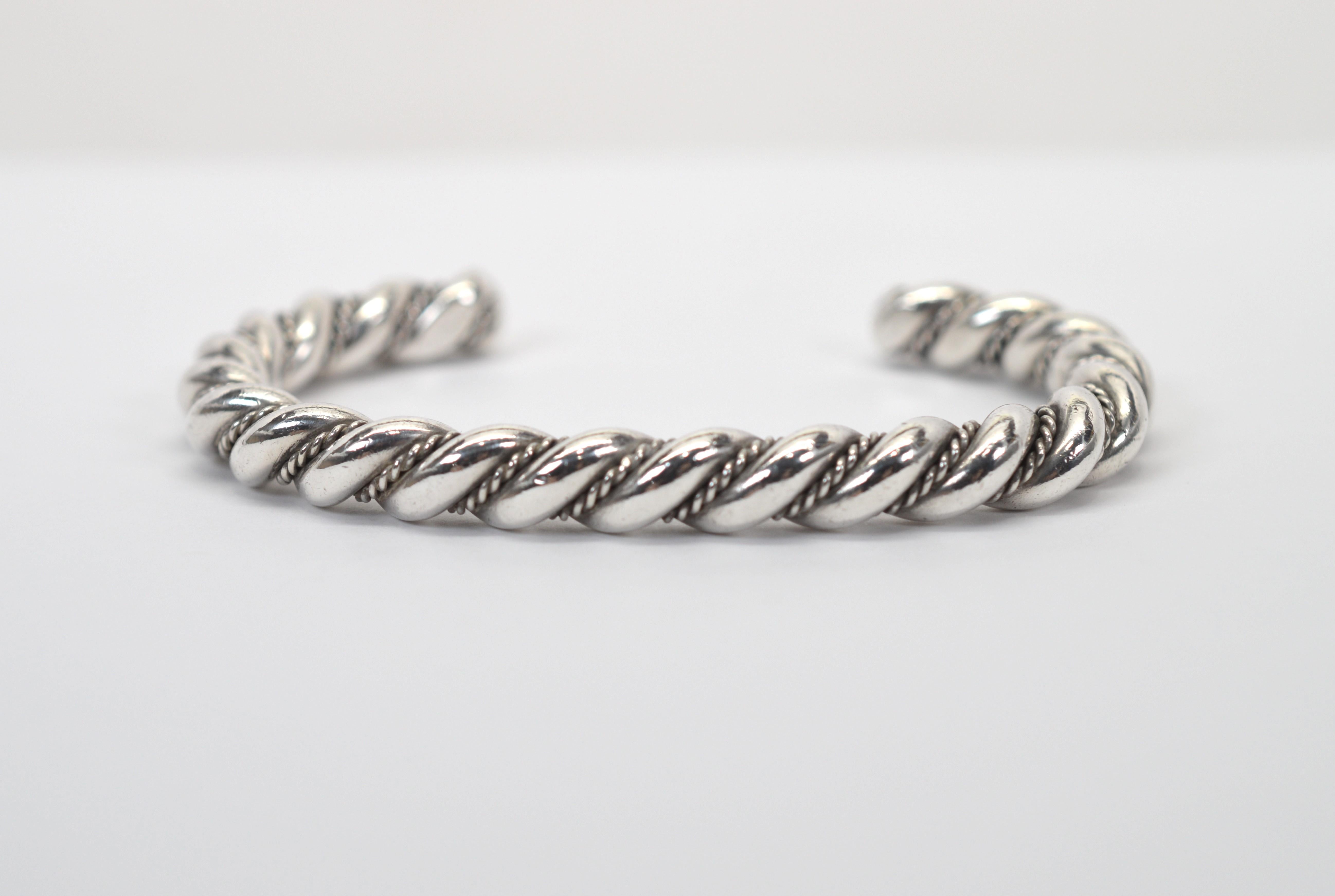Crafted in heavy 64mm gauge .925 sterling silver, this unisex cuff bracelet measures a generous 3-1/4 inch.  Enhanced with an integrated bead rope detail, this finely made artisan piece has a 1-3/8 inch opening to easily apply to the wrist. To
