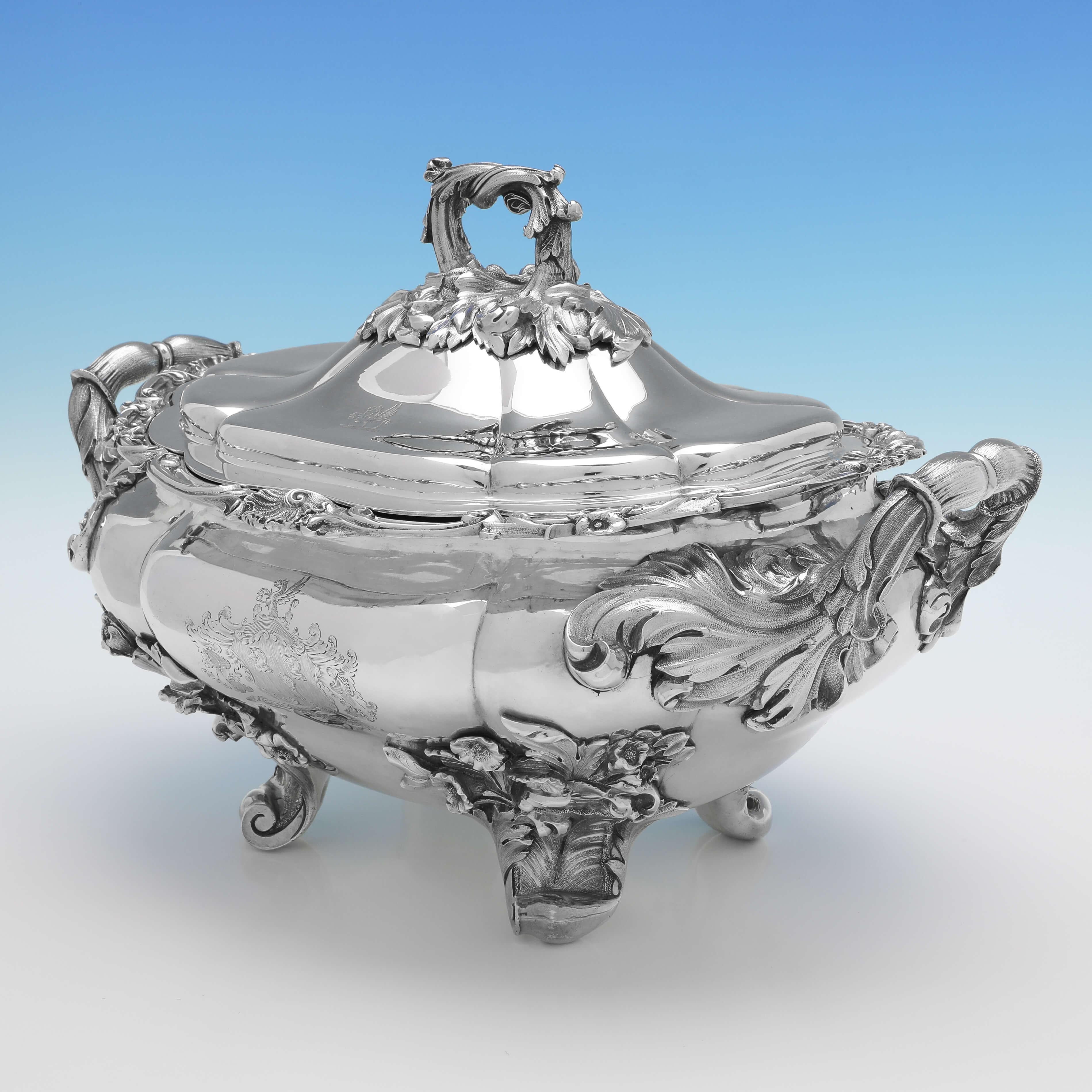 Hallmarked in London in 1827 by Benjamin Preston, this incredible, Antique Sterling Silver Soup Tureen, is a masterpiece of the regency style, with cast and applied feet and handles, and an engraved coat of arms. The soup tureen measures 10.5