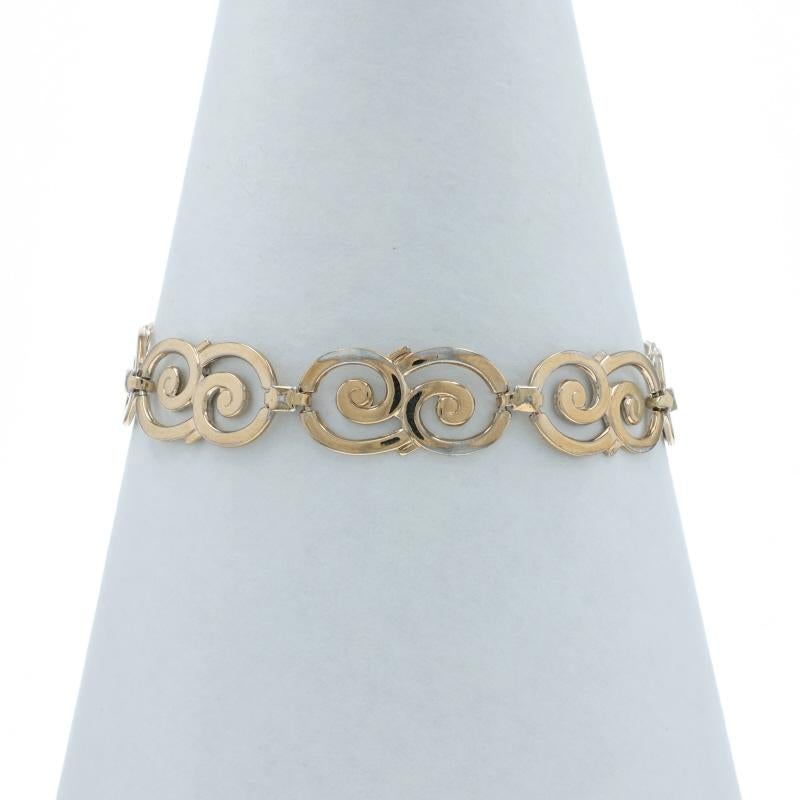 Metal Content: Sterling Silver 
14k Yellow Gold

Bracelet Style: Link
Fastening Type: Fold-Over Clasp
Theme: Spiral Duo, Swirls

Measurements

Chain Width: 1/8