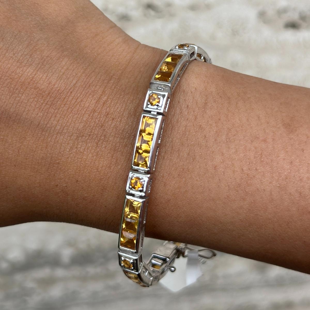 Square Cut Citrine Gemstone Tennis Bracelet Grandma Gift in sterling silver showcases endlessly sparkling natural citrine. It measures 7 inches long in length. 
Citrine stimulate concentration and reduces stress. 
Designed with perfect square, round