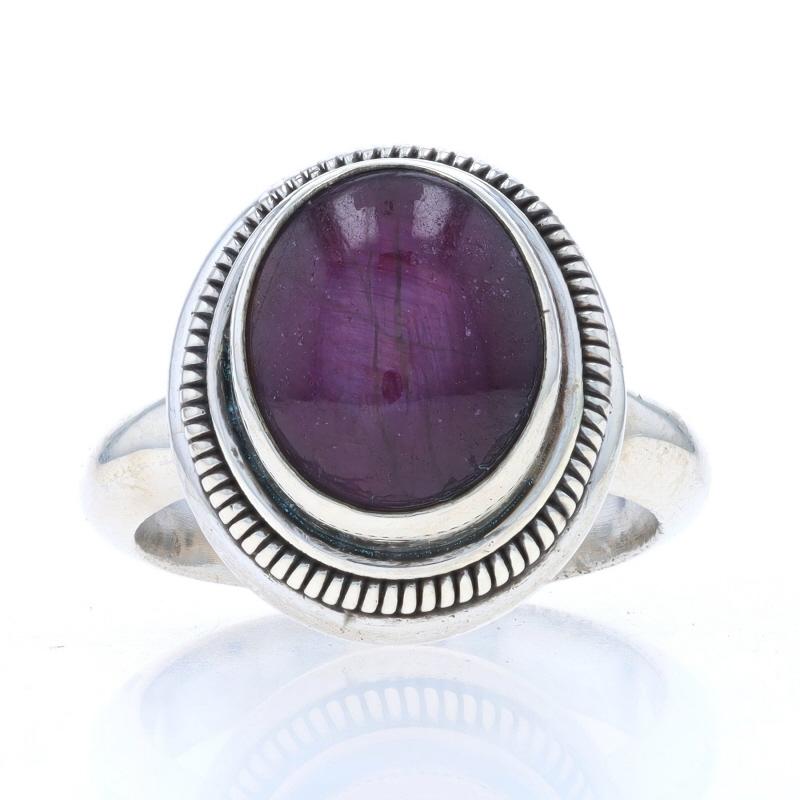 Size: 7 3/4
Sizing Fee: Up 3 sizes for $25 or Down 1 1/2 sizes for $25

Metal Content: Sterling Silver

Stone Information

Natural Star Ruby
Treatment: Heating
Cut: Oval Cabochon
Color: Purplish Red

Style: Cocktail Solitaire
Features: Ribbed Border