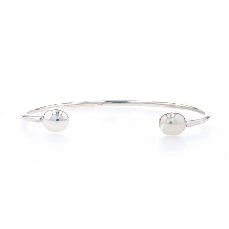 Metal Content: Sterling Silver

Style: Starter Charm Cuff
Fastening Type: N/A (slides over wrist)
Features: One end cap unscrews to allow charms to be added to the bracelet.

Measurements

Inner circumference (including the opening): 6 3/4