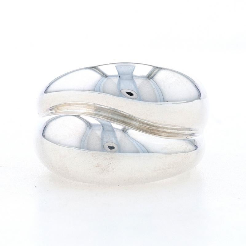 Size: 6 3/4
Sizing Fee: Down or up 2 sizes for $35

Metal Content: 925 Sterling Silver

Style: Statement and Band
Theme: Abstract

Measurements

Face Height (north to south): 5/8