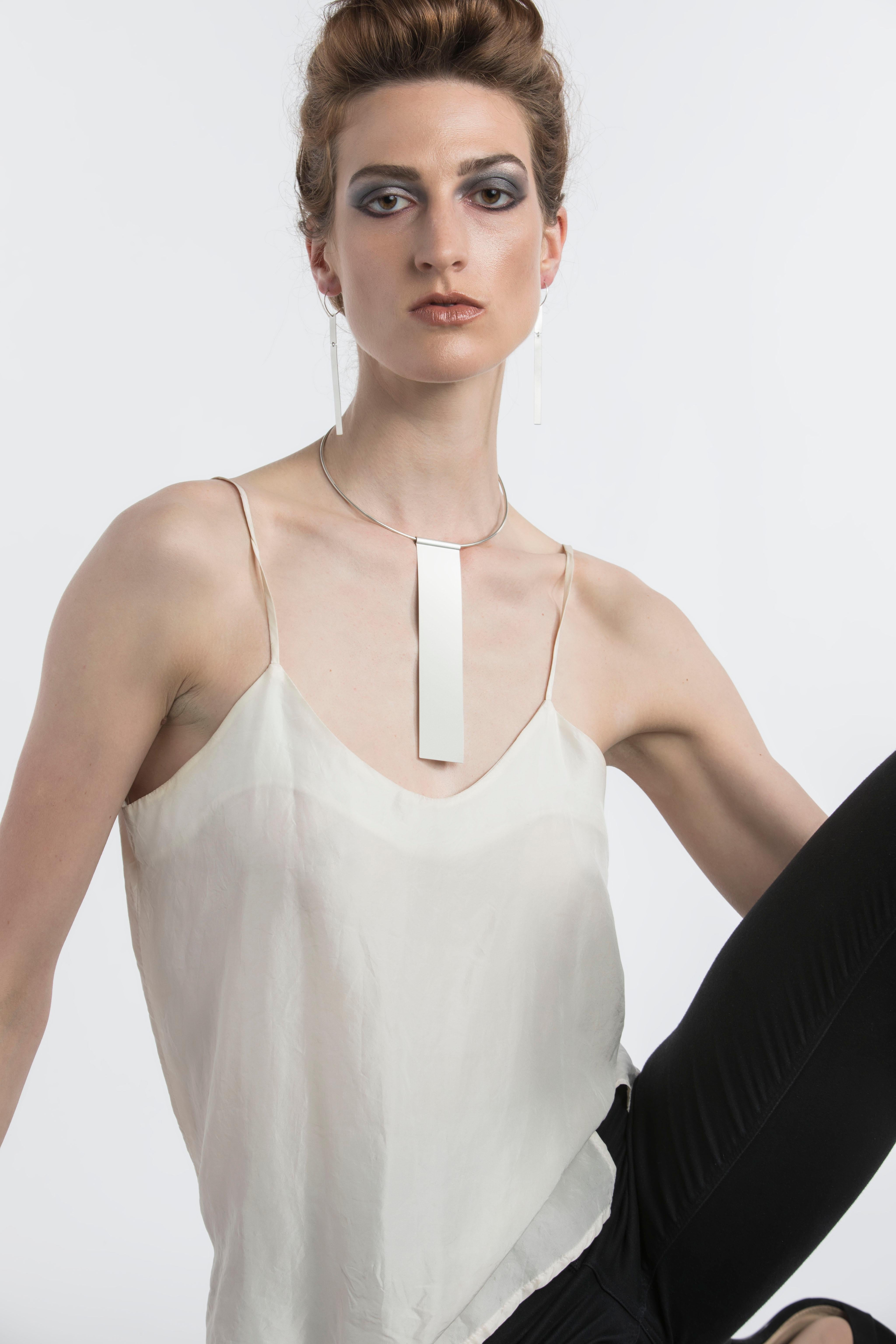 Handcrafted by artist Kyla Katz in the United States, this sterling silver collar is minimalist perfection. Stand out with simplicity with this distinctive piece. Pendant is 6