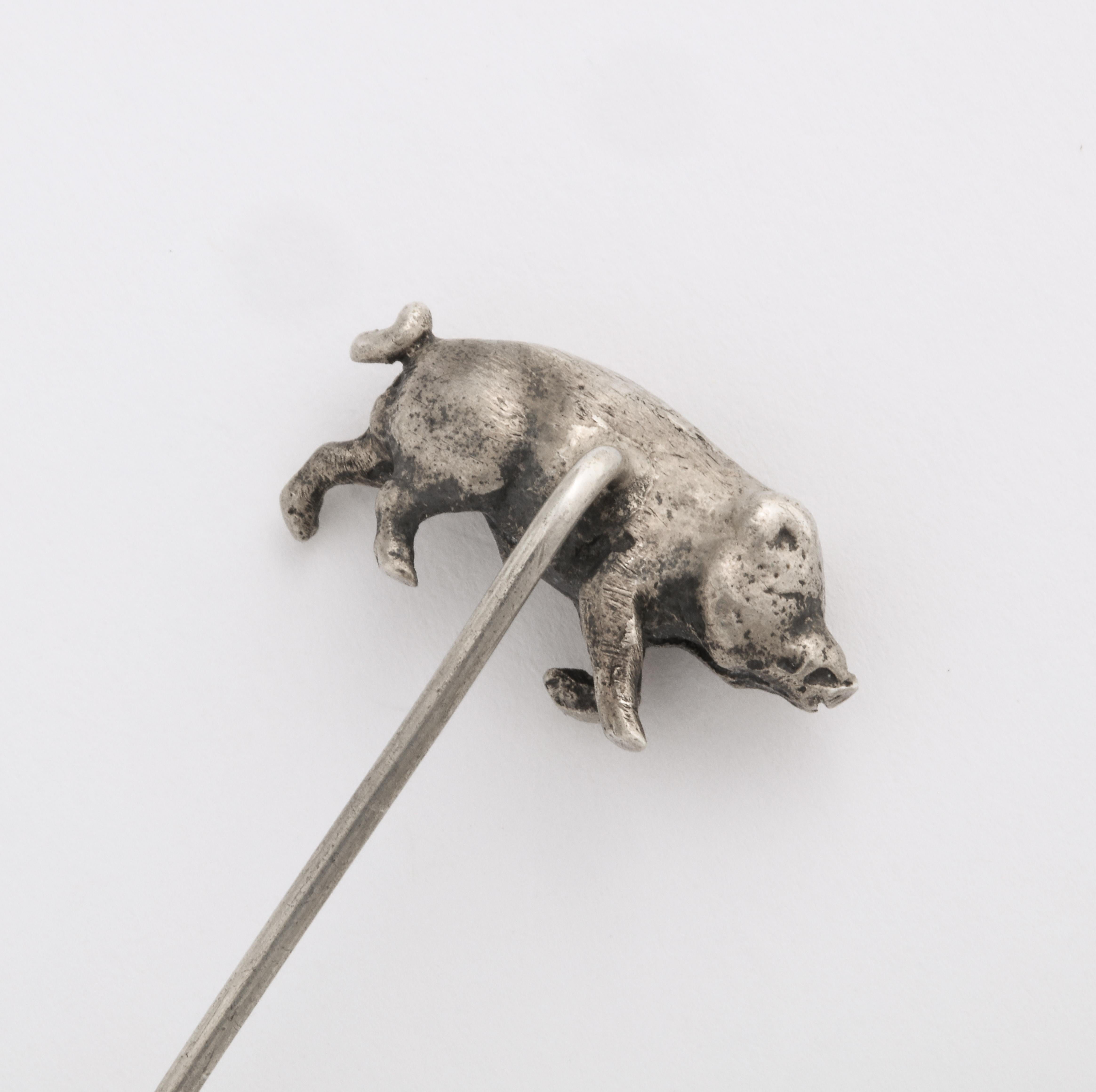 Here piggy, piggy is not what you say to a wild boar unless it is an silver stickpin. It is very much like a wild boar appears in person.I have seen them them at close range. The stickpin is whimsical and full of character with its curlicue tail.
