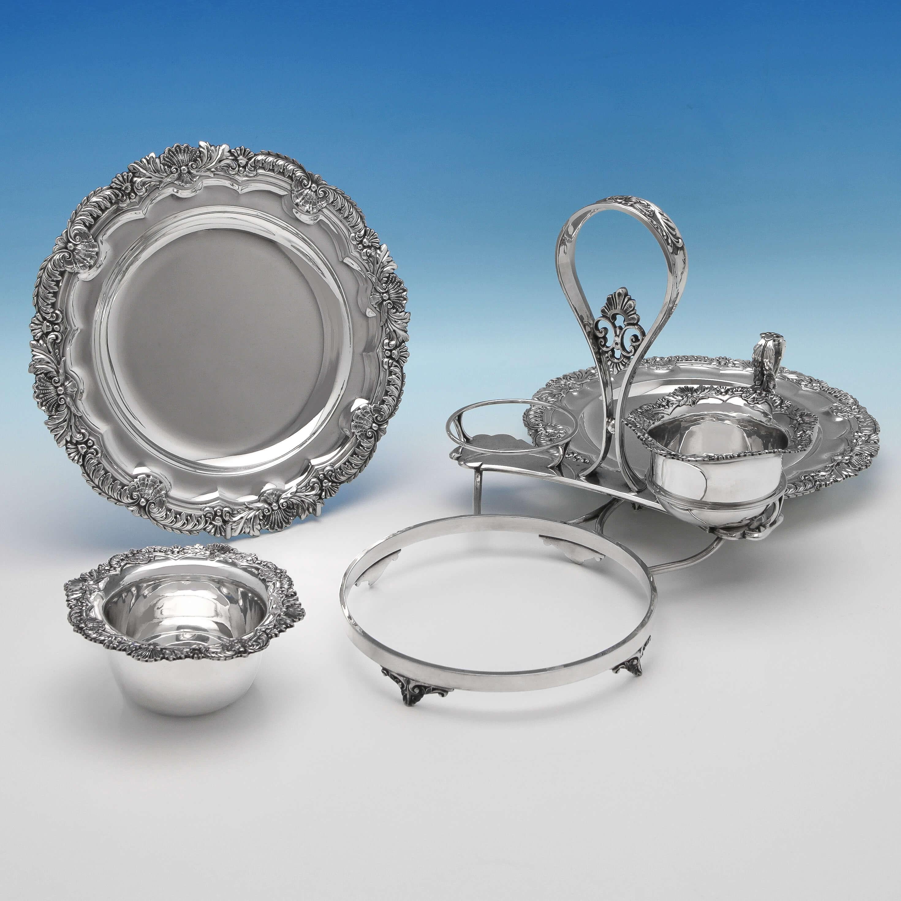 Hallmarked in Sheffield in 1907 by James Dixon & Sons, this rare, Edwardian, antique, sterling silver strawberry dish, comprises 2 plates, a sugar bowl and cream jug. All presented in a frame, and all featuring shell and acanthus borders and