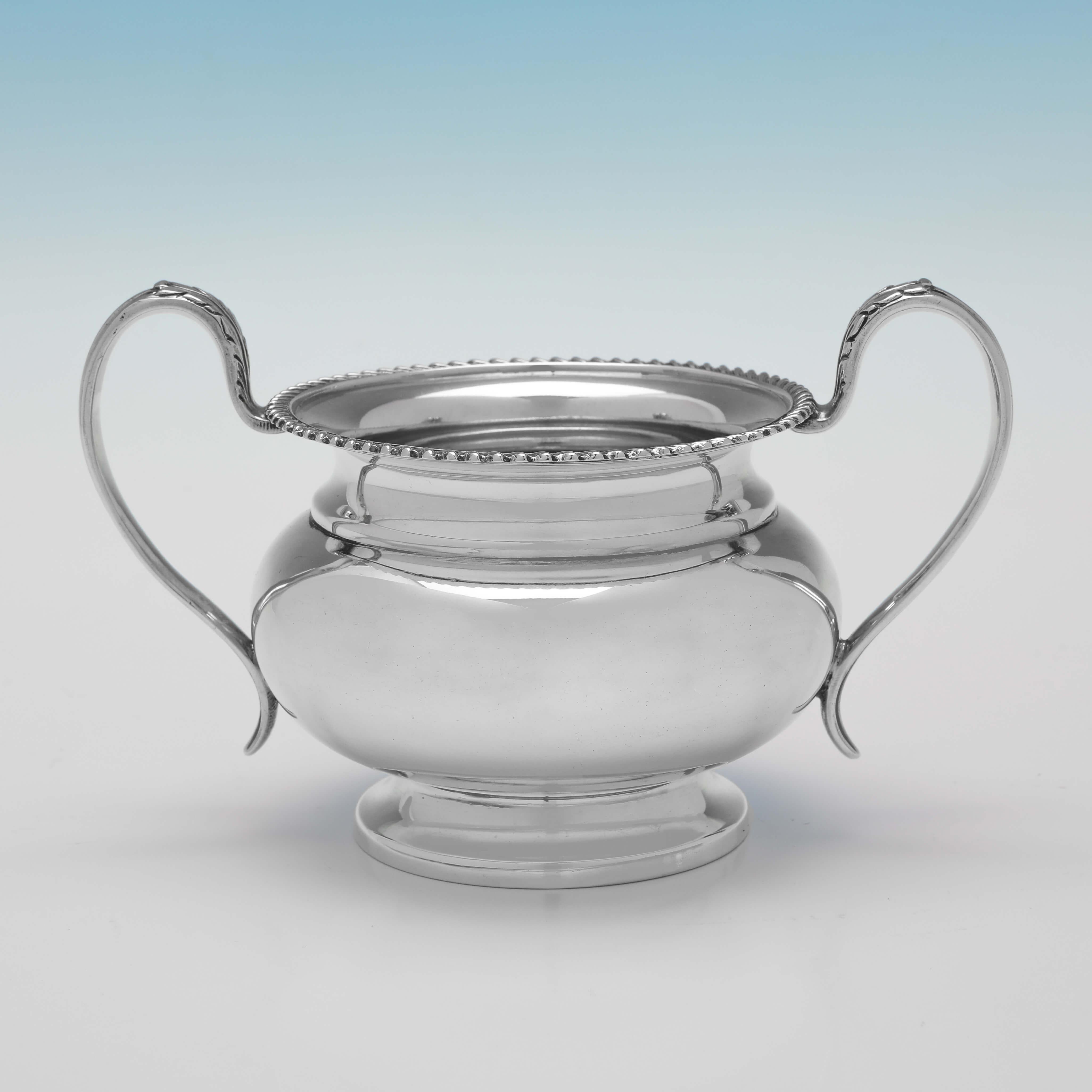 Hallmarked in Sheffield in 1927 by Mappin & Webb, this handsome Sterling Silver Sugar and Cream, are round in shape, and feature gadroon borders. 

The sugar bowl measures 3.75